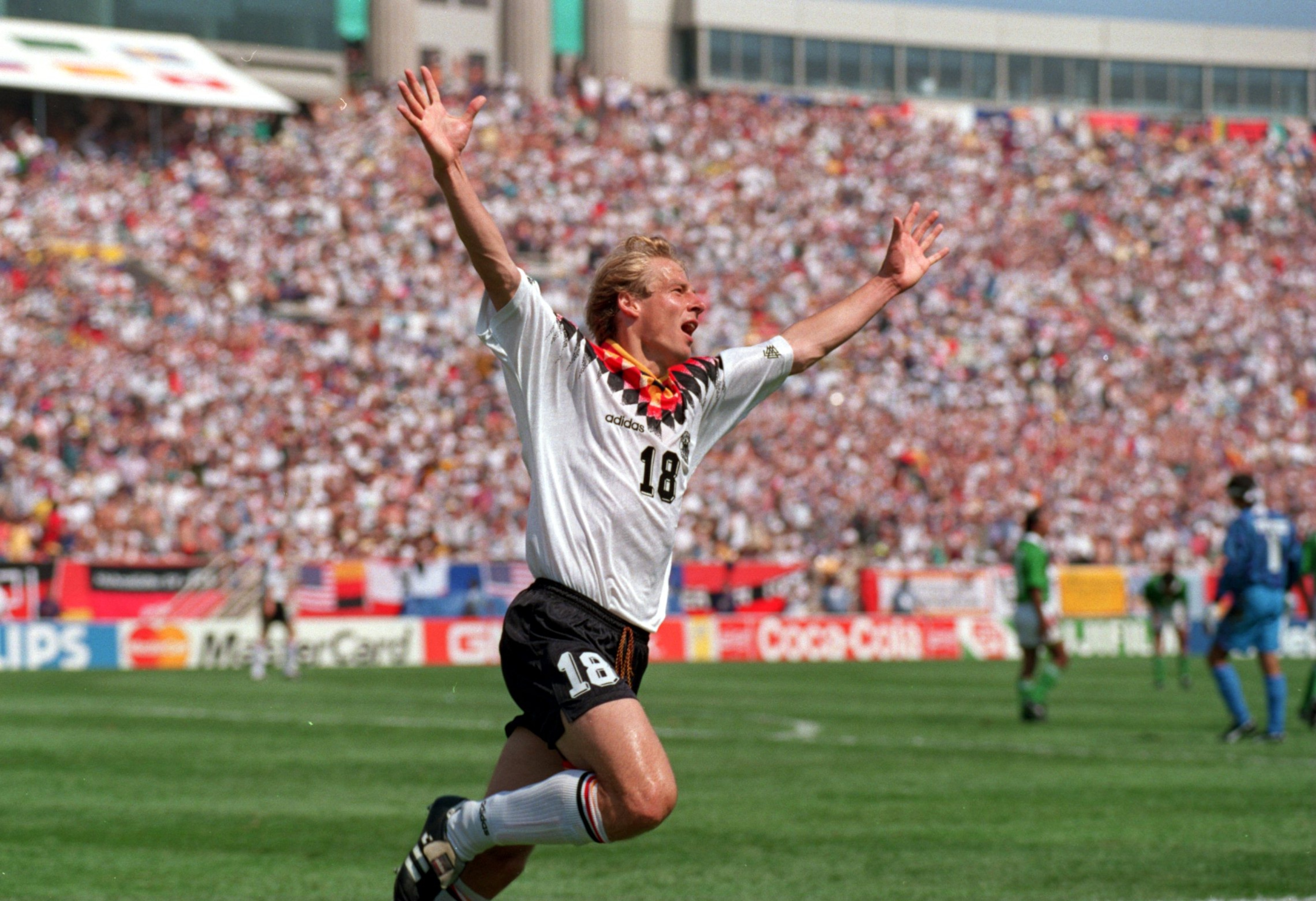 17 JUN 1994: JUERGEN KLINSMANN OF GERMANY CELEBRATES AFTER SCORING THE ONLY GOAL AGAINST BOLIVIA IN THE OPENING GAME OF THE 1994 WORLD CUP AT SOLDIER FIELD IN CHICAGO, ILLINOIS. Mandatory Credit: Shaun Botterill/ALLSPORT 17 JUN 1994: JUERGEN KLINSMANN OF GERMANY CELEBRATES AFTER SCORING THE ONLY GOAL AGAINST BOLIVIA IN THE OPENING GAME OF THE 1994 WORLD CUP AT SOLDIER FIELD IN CHICAGO, ILLINOIS. Mandatory Credit: Shaun Botterill/ALLSPORT
