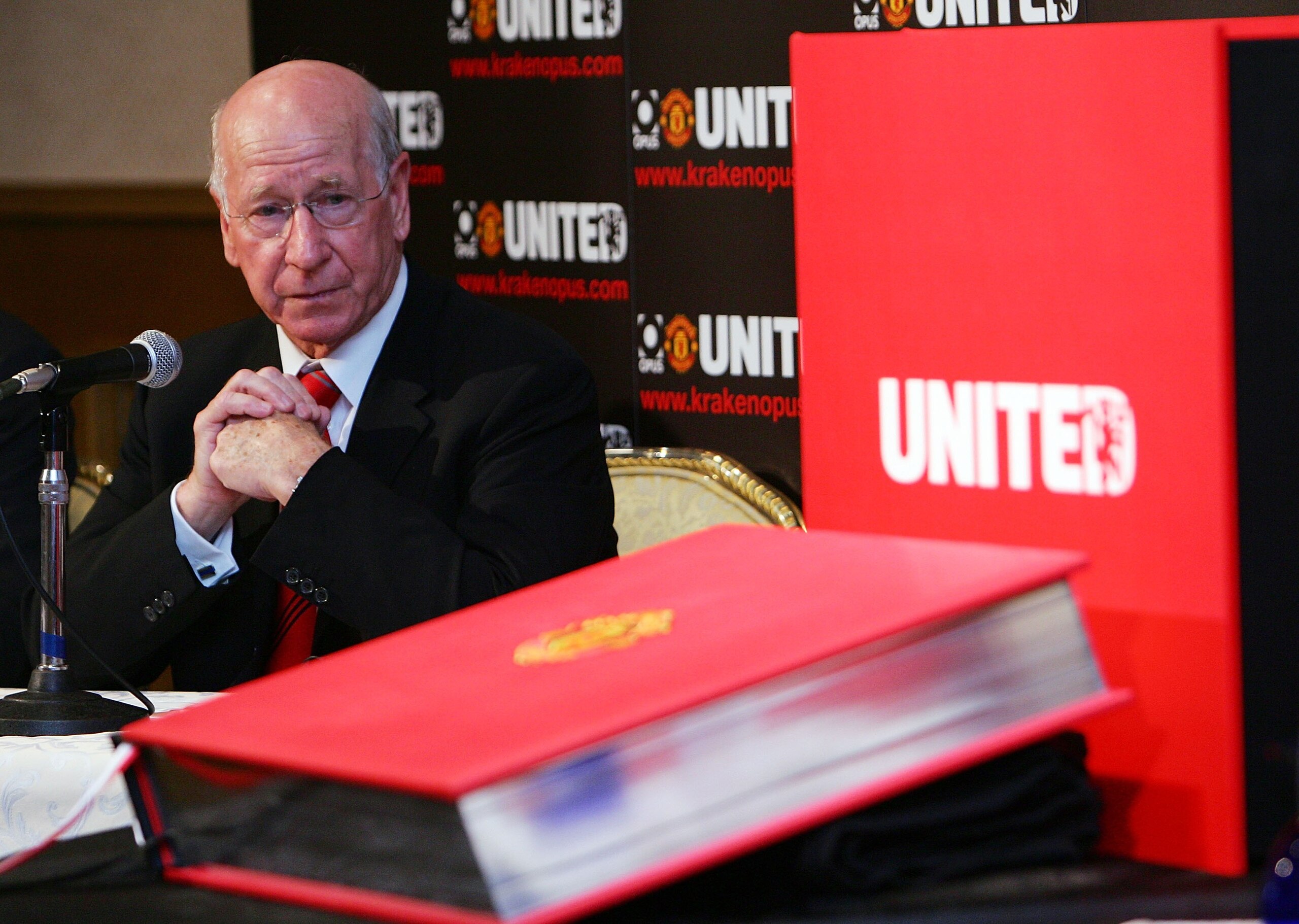 TOKYO - JULY 16:  Sir Bobby Charlton speaks next to the Manchester United's Opus book during a press conference on July 16, 2007 in Tokyo, Japan. The book will be available from July 16 in Japan.  (Photo by Junko Kimura/Getty Images)