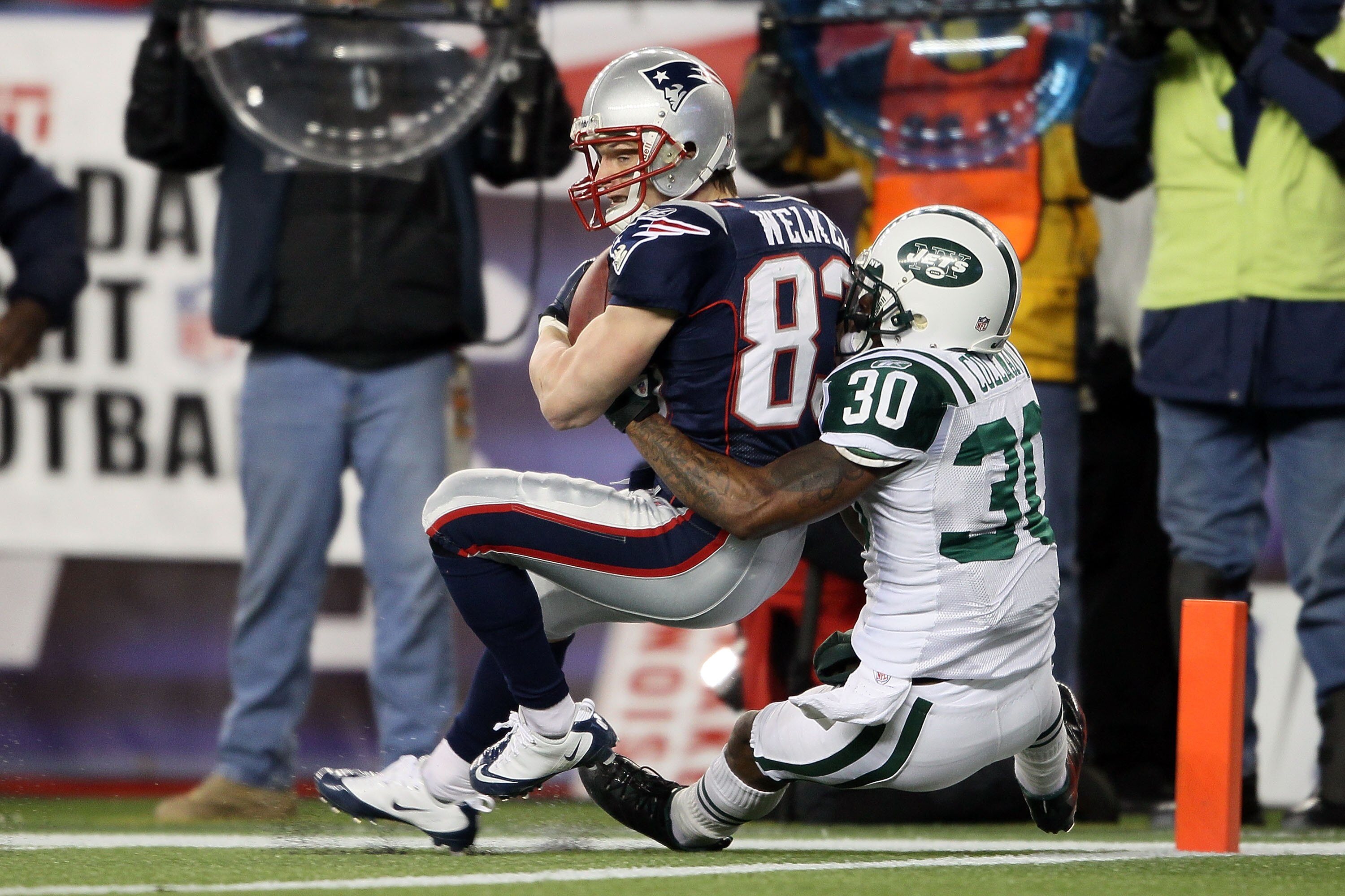 FOXBORO, MA - DECEMBER 06: Wes Welker #83 of the New England Patriots scores an 18-yard touchdown reception in the third quarter against Drew Coleman #30 of the New York Jets at Gillette Stadium on December 6, 2010 in Foxboro, Massachusetts. (Photo by E FOXBORO, MA - DECEMBER 06: Wes Welker #83 of the New England Patriots scores an 18-yard touchdown reception in the third quarter against Drew Coleman #30 of the New York Jets at Gillette Stadium on December 6, 2010 in Foxboro, Massachusetts. (Photo by E