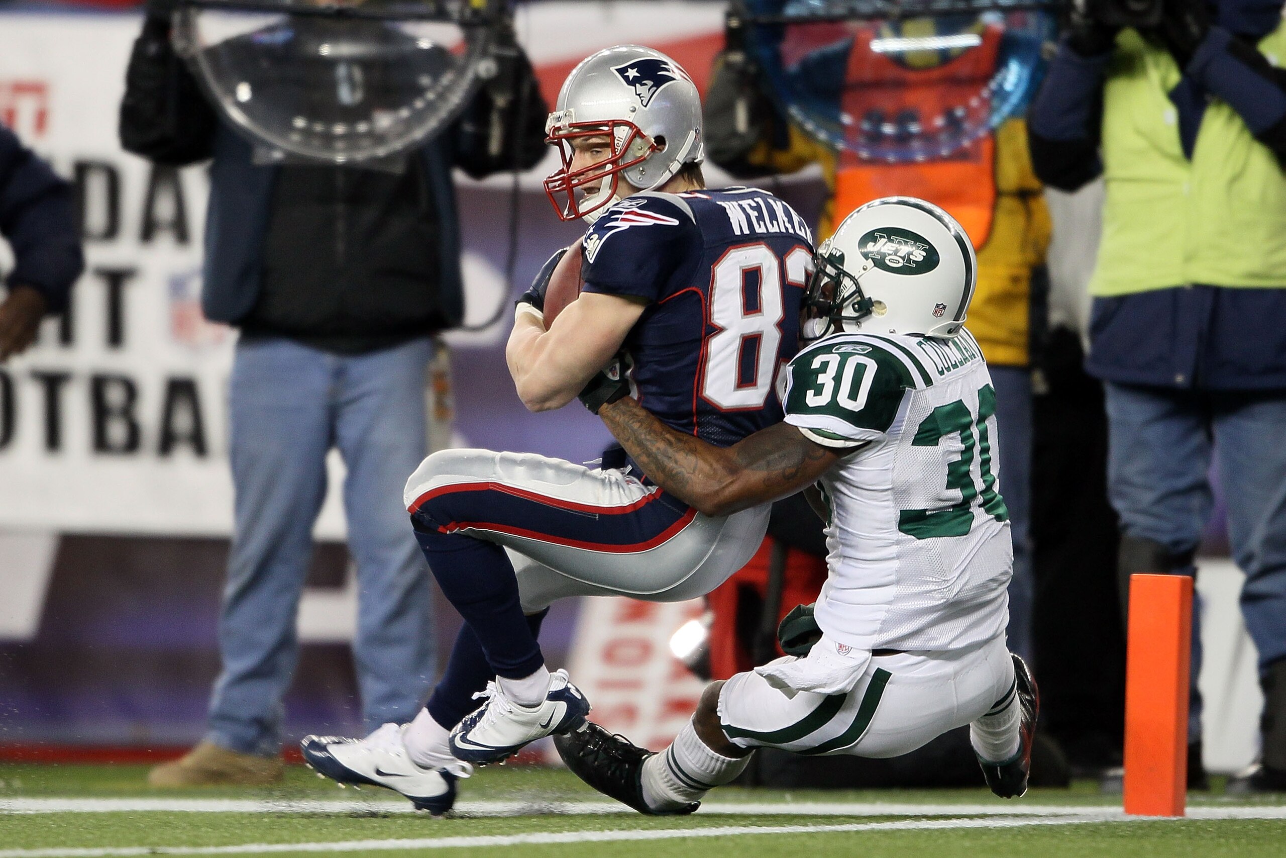 FOXBORO, MA - DECEMBER 06: Wes Welker #83 of the New England Patriots scores an 18-yard touchdown reception in the third quarter against Drew Coleman #30 of the New York Jets at Gillette Stadium on December 6, 2010 in Foxboro, Massachusetts. (Photo by E FOXBORO, MA - DECEMBER 06: Wes Welker #83 of the New England Patriots scores an 18-yard touchdown reception in the third quarter against Drew Coleman #30 of the New York Jets at Gillette Stadium on December 6, 2010 in Foxboro, Massachusetts. (Photo by E