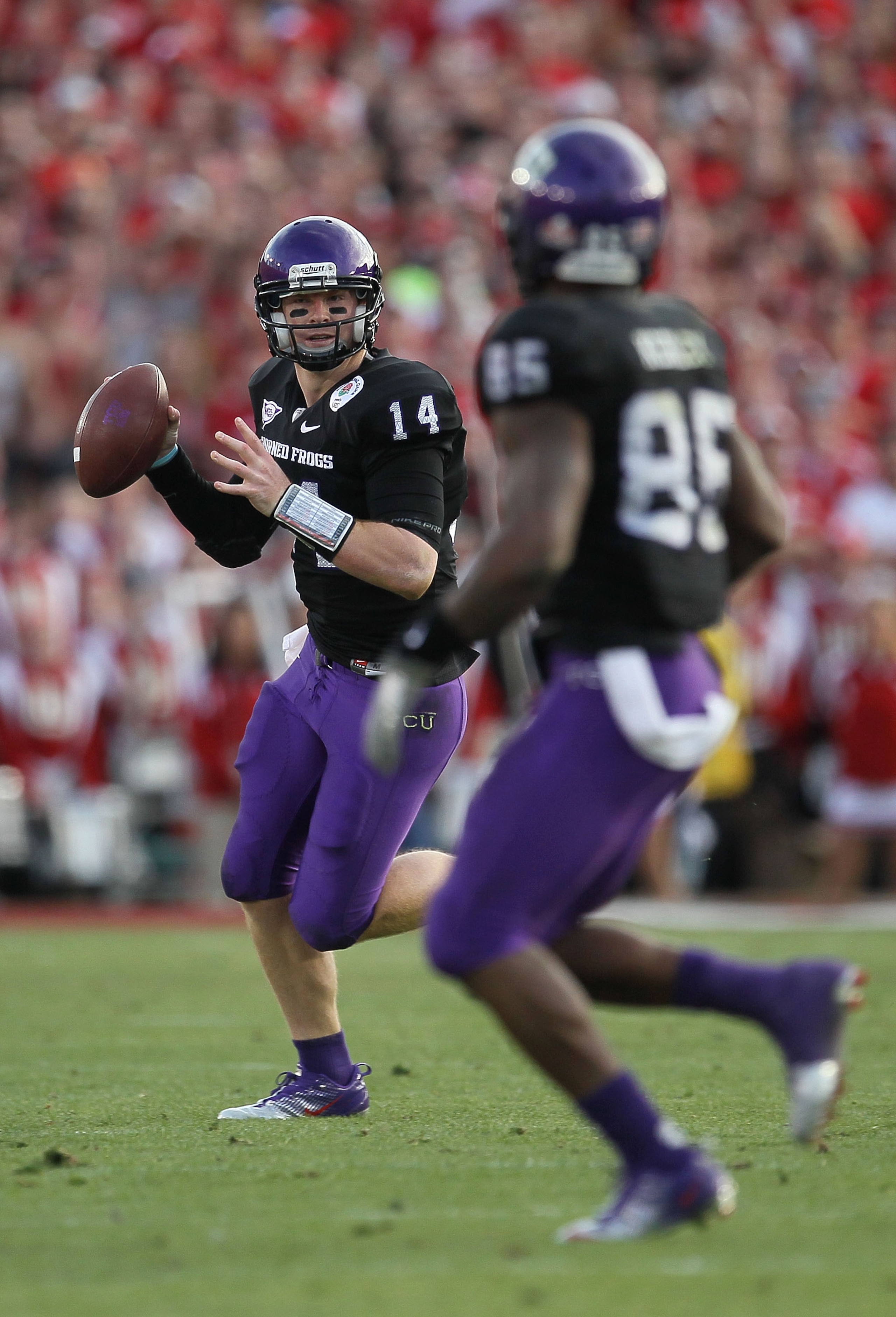 PASADENA, CA - JANUARY 01:  Quarterback Andy Dalton #14 of the TCU Horned Frogs looks to pass against the Wisconsin Badgers during the 97th Rose Bowl game on January 1, 2011 in Pasadena, California.  (Photo by Stephen Dunn/Getty Images)