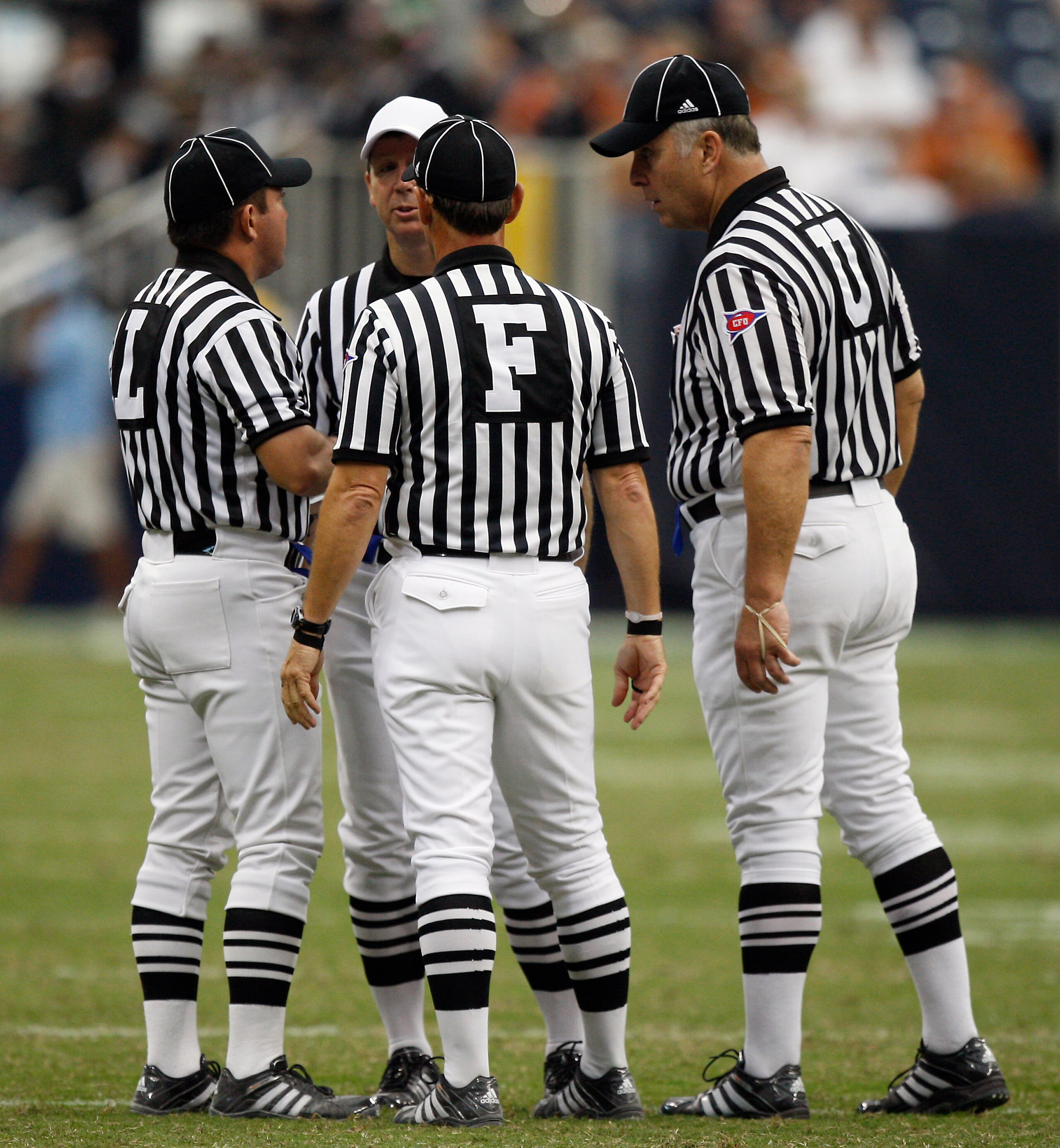 HOUSTON - SEPTEMBER 04: The officials get together to discuss a penalty called on the play during a football game beyween the Texas Longhorns and Rice Owls at Reliant Stadium on September 4, 2010 in Houston, Texas. (Photo by Bob Levey/Getty Images) HOUSTON - SEPTEMBER 04: The officials get together to discuss a penalty called on the play during a football game beyween the Texas Longhorns and Rice Owls at Reliant Stadium on September 4, 2010 in Houston, Texas. (Photo by Bob Levey/Getty Images)