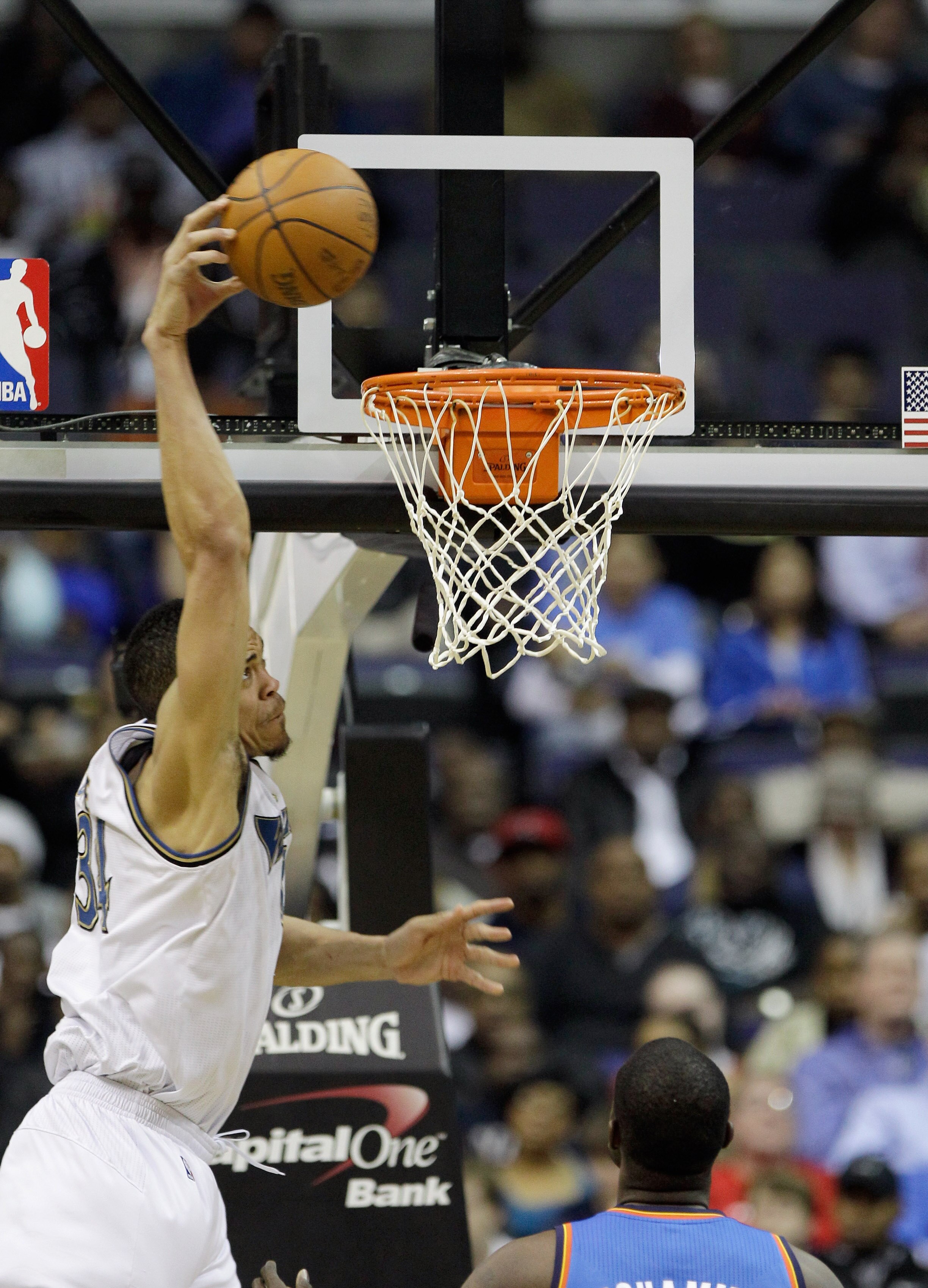 WASHINGTON, DC - MARCH 14: JaVale McGee #34 of the Washington Wizards dunks against the Oklahoma City Thunder during the first half at the Verizon Center on March 14, 2011 in Washington, DC. NOTE TO USER: User expressly acknowledges and agrees that, by do