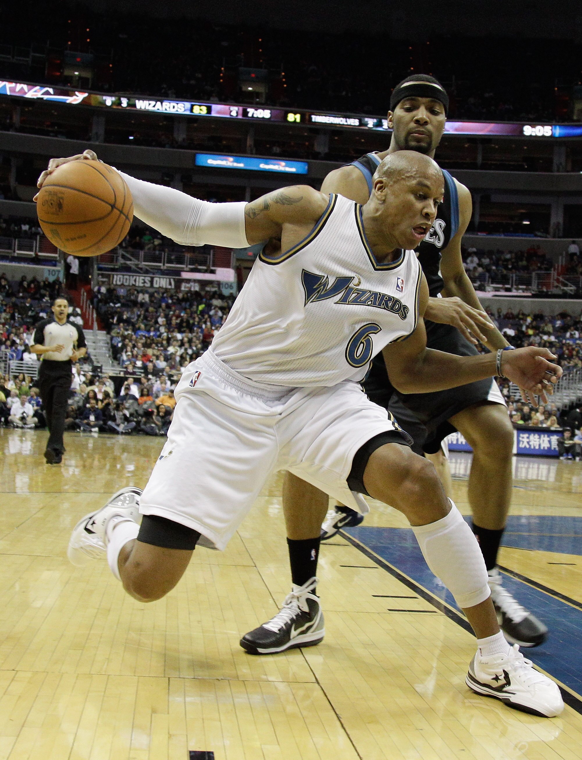 WASHINGTON, DC - MARCH 05:  Maurice Evans #6 of the Washington Wizards is guarded by Lazar Hayward #32 of the Minnesota Timberwolves at the Verizon Center on March 5, 2011 in Washington, DC. NOTE TO USER: User expressly acknowledges and agrees that, by do