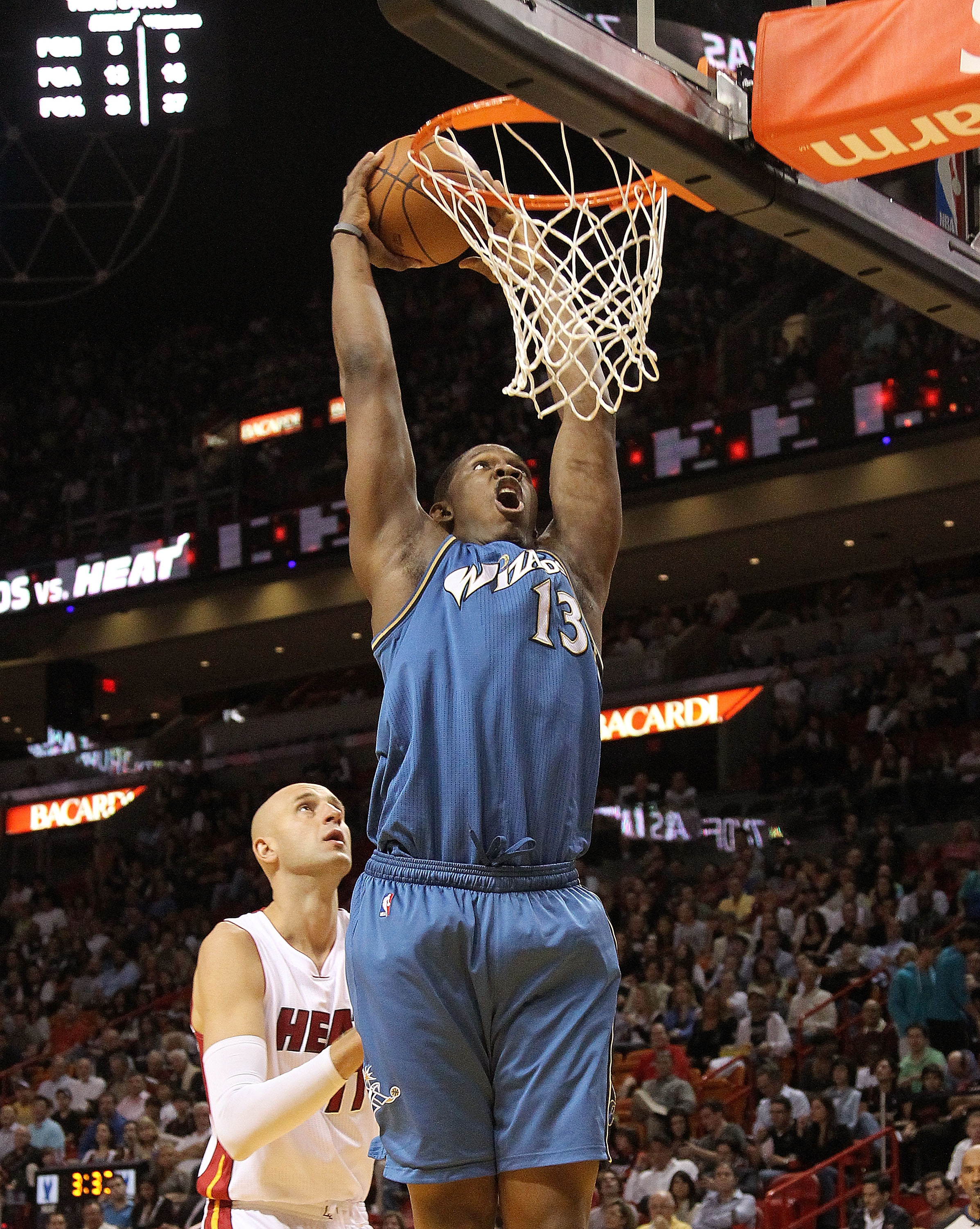 MIAMI, FL - FEBRUARY 25: Kevin Seraphin #13  of the  Washington Wizards dunks during a game against the Miami Heat  at American Airlines Arena on February 25, 2011 in Miami, Florida. NOTE TO USER: User expressly acknowledges and agrees that, by downloadin