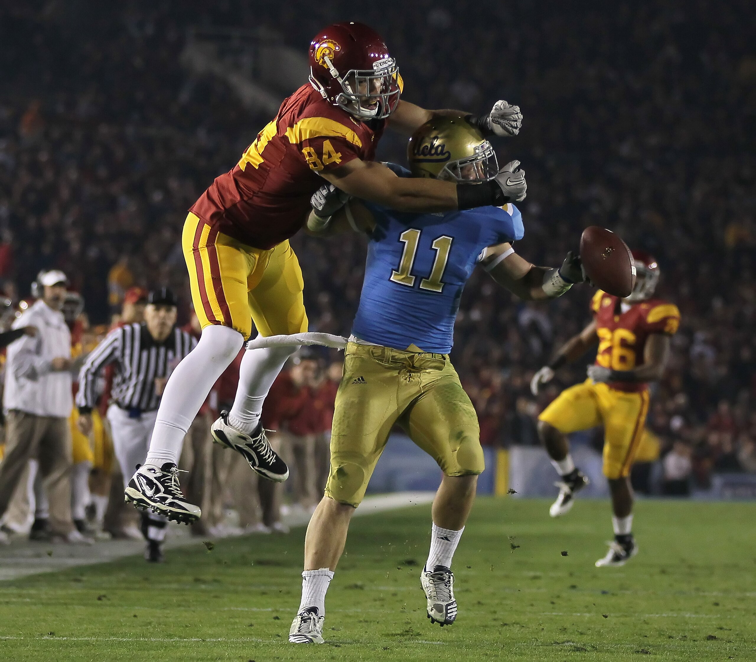 PASADENA, CA - DECEMBER 04: Sean Westgate #11 of the UCLA Bruins breaks up a pass intended for Jordan Cameron #84 of the USC Trojans during the first half at the Rose Bowl on December 4, 2010 in Pasadena, California. USC defeated UCLA 28-14. (Photo by J PASADENA, CA - DECEMBER 04: Sean Westgate #11 of the UCLA Bruins breaks up a pass intended for Jordan Cameron #84 of the USC Trojans during the first half at the Rose Bowl on December 4, 2010 in Pasadena, California. USC defeated UCLA 28-14. (Photo by J