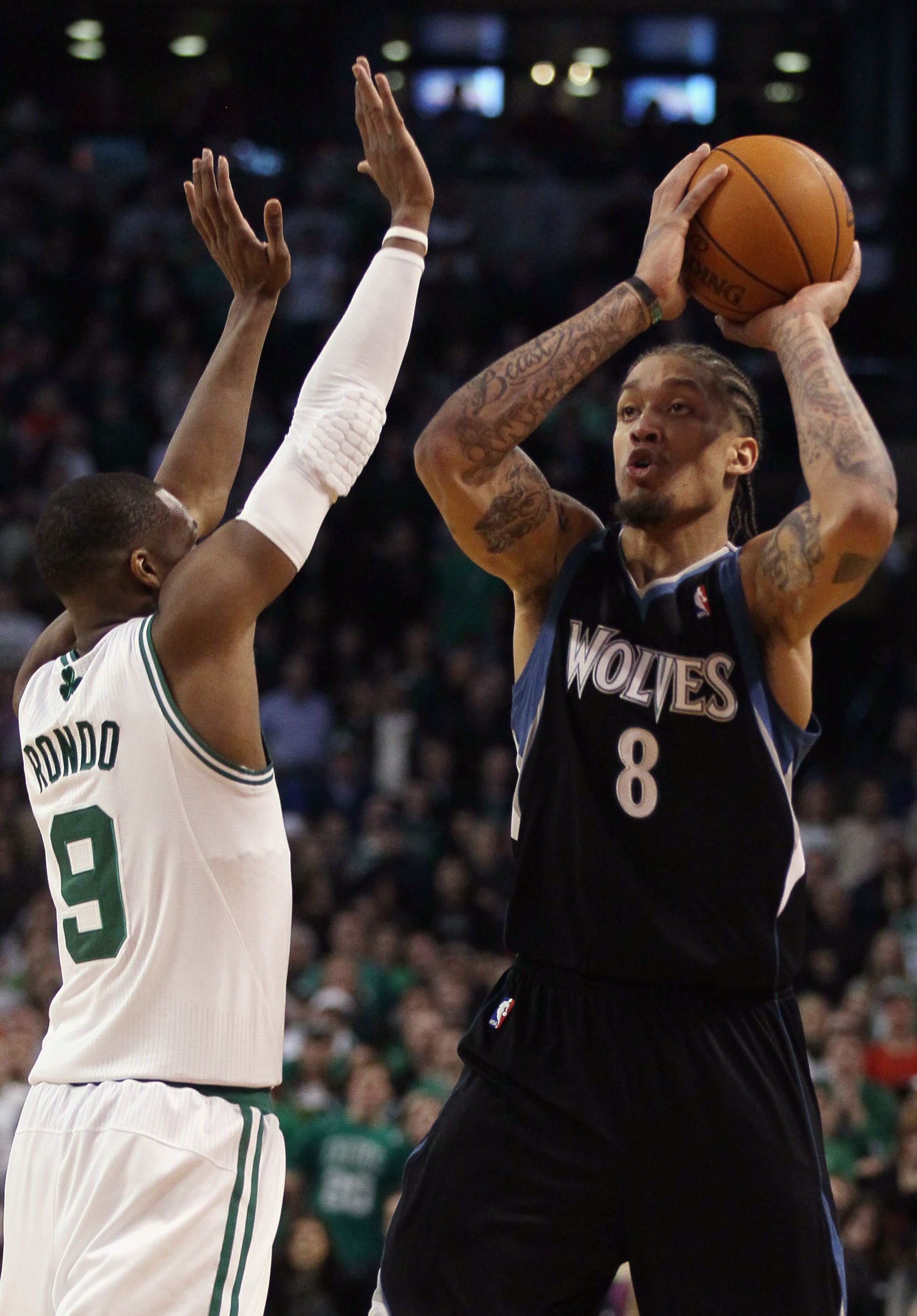 BOSTON, MA - JANUARY 03:  Michael Beasley #8 of the Minnesota Timberwolves takes the last shot of the game as Rajon Rondo #9 of the Boston Celtics defends on January 3, 2011 at the TD Garden in Boston, Massachusetts. The Celtics defeated the Timberwolves