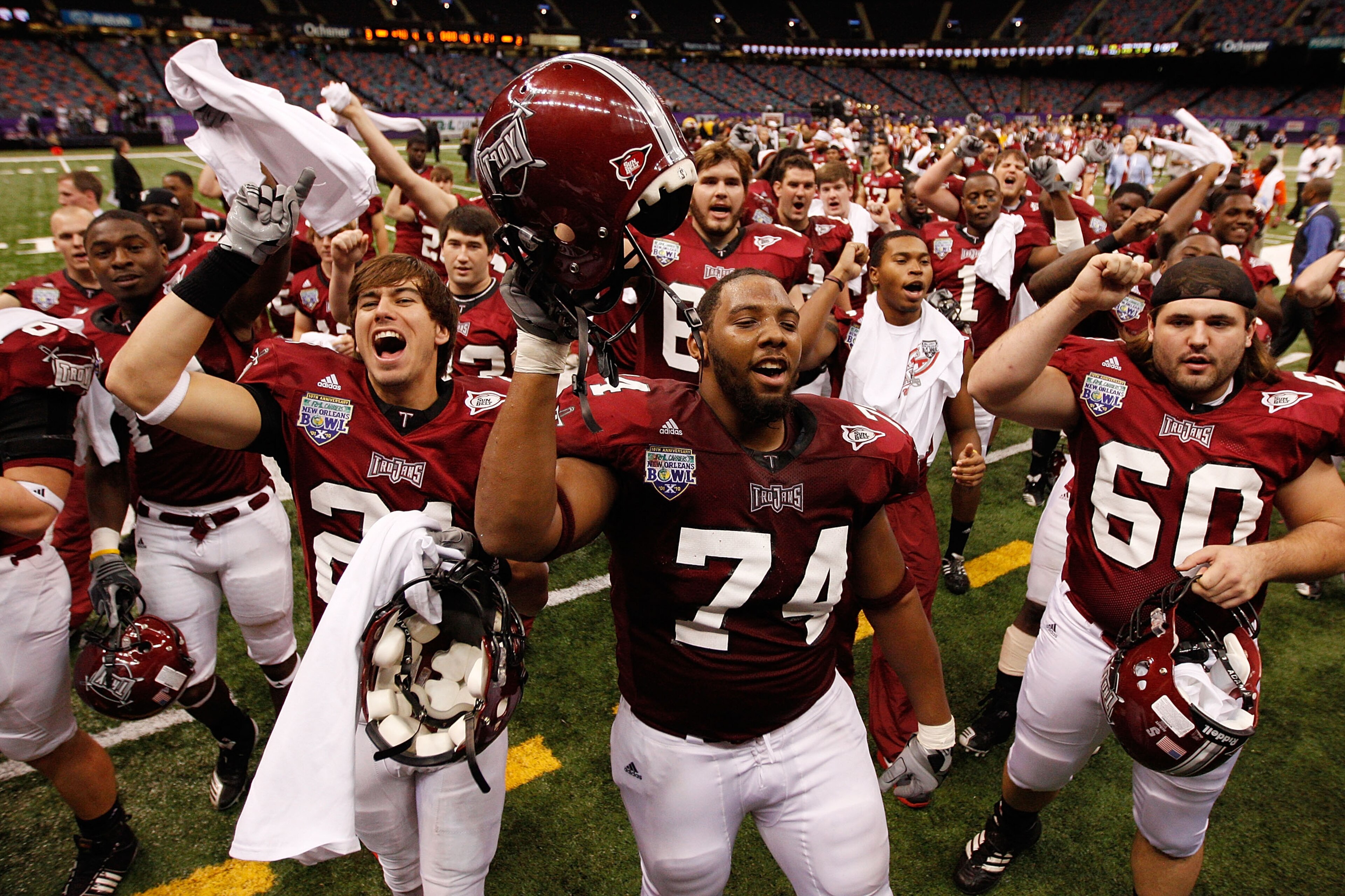 NEW ORLEANS, LA - DECEMBER 18:  Members of the Troy University Trojans celebrate after defeating the Ohio University Bobcats 48-21 during the R&L Carriers New Orleans Bowl at the Louisiana Superdome on December 18, 2010 in New Orleans, Louisiana.  (Photo 