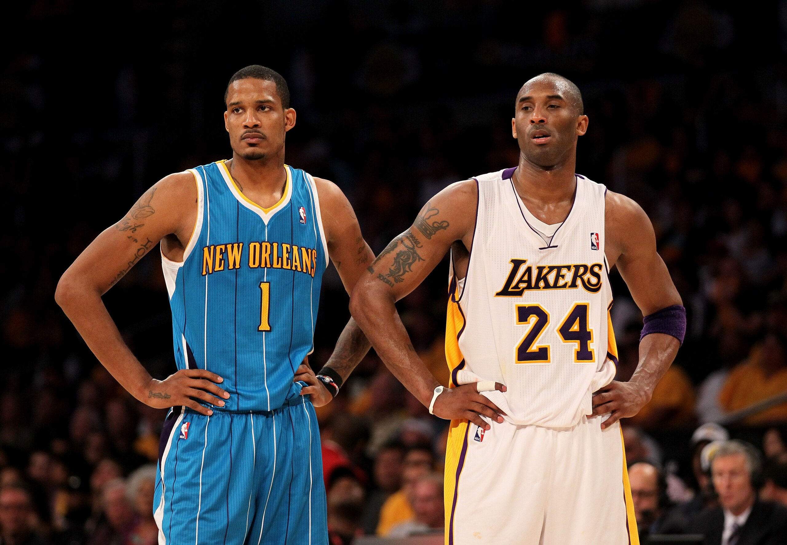 LOS ANGELES, CA - APRIL 17: Trevor Ariza #1 of the New Orleans Hornets and Kobe Bryant #24 of the Los Angeles Lakers stand during a break in Game One of the Western Conference Quarterfinals in the 2011 NBA Playoffs on April 17, 2011 at Staples Center in LOS ANGELES, CA - APRIL 17: Trevor Ariza #1 of the New Orleans Hornets and Kobe Bryant #24 of the Los Angeles Lakers stand during a break in Game One of the Western Conference Quarterfinals in the 2011 NBA Playoffs on April 17, 2011 at Staples Center in