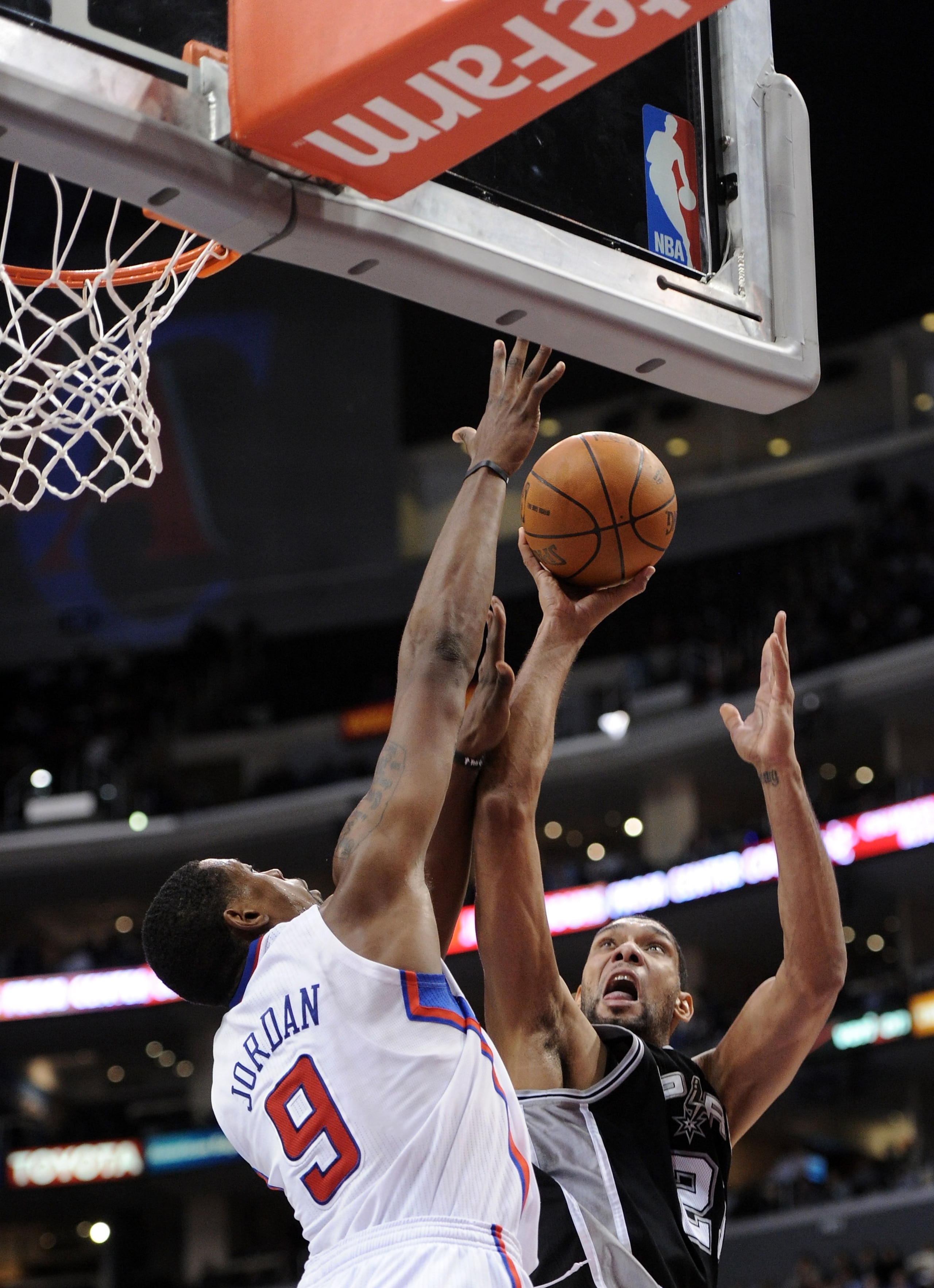 LOS ANGELES, CA - DECEMBER 01:  Tim Duncan #21 of the San Antonio Spurs has his shot blocked by DeAndre Jordan #9 of the Los Angeles Clippers at the Staples Center on December 1, 2010 in Los Angeles, California.  NOTE TO USER: User expressly acknowledges
