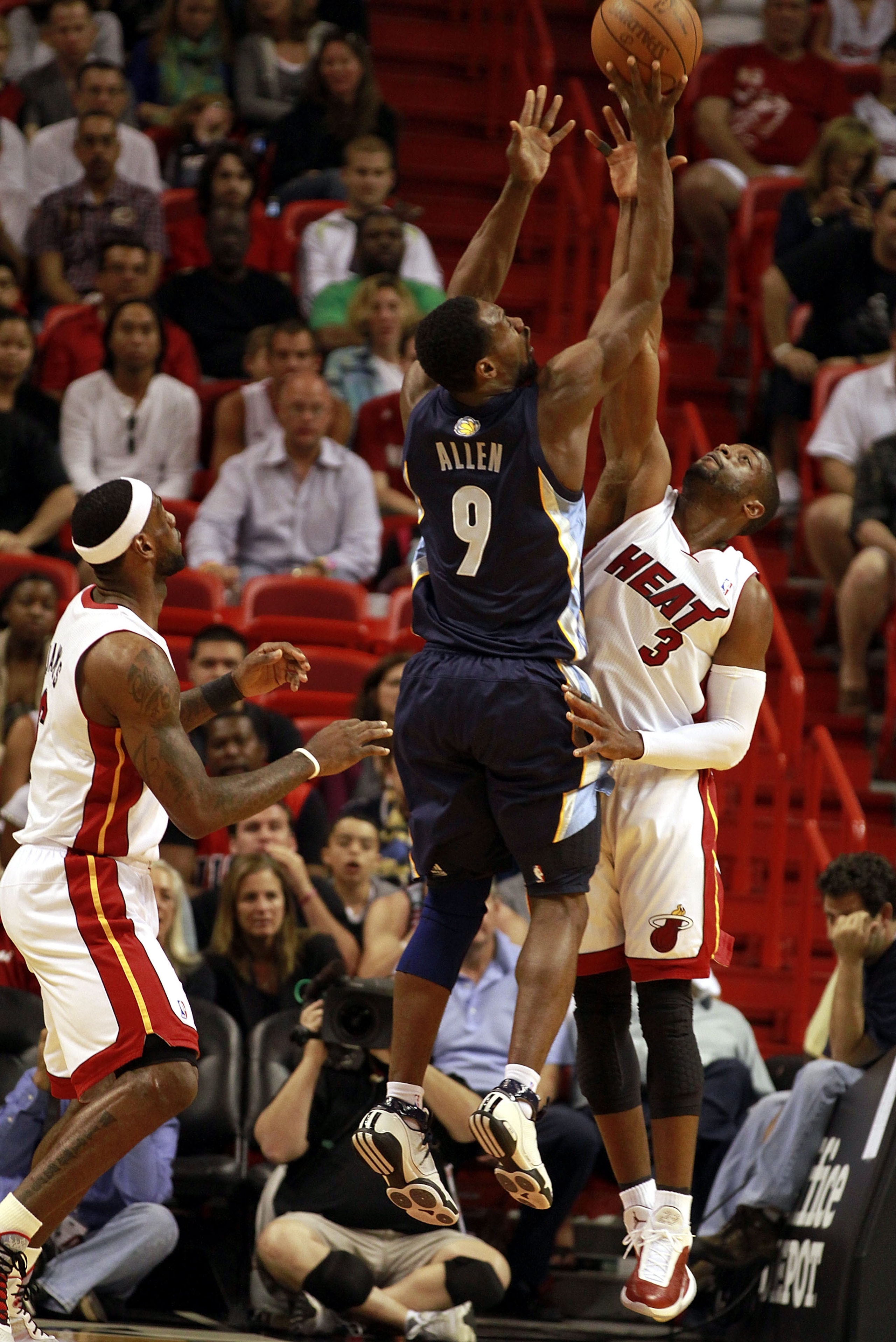 MIAMI - MARCH 12:  Guard Dwyane Wade #3 of the Miami Heat blocks a shot against Tony Allen #9 of the Memphis Grizzlies at American Airlines Arena on March 12, 2011 in Miami, Florida. NOTE TO USER: User expressly acknowledges and agrees that, by downloadin
