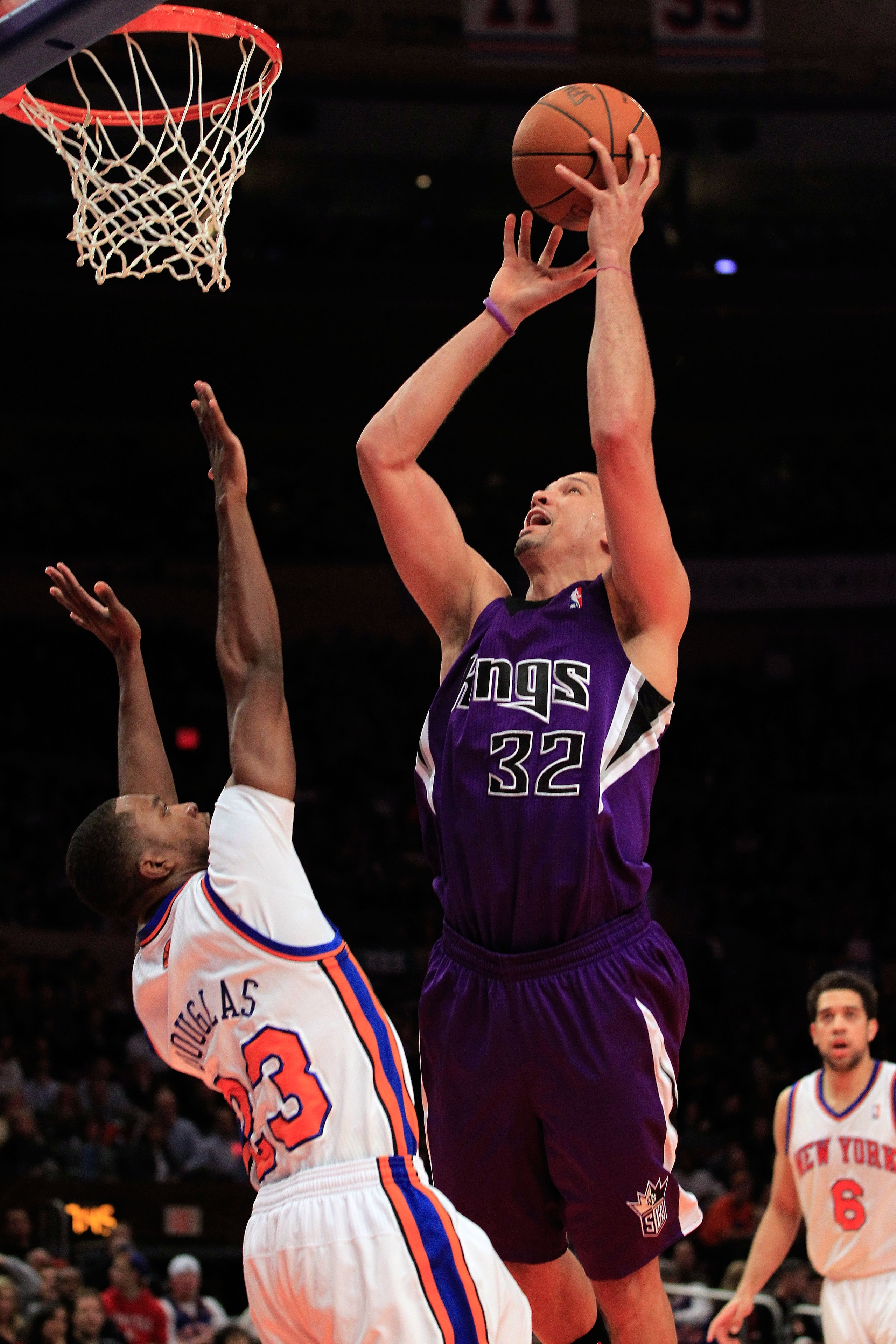 NEW YORK, NY - JANUARY 14:  Francisco Garcia #32 of the Sacramento Kings shoots the ball over the block of Toney Douglas #23 of the New York Knicks at Madison Square Garden on January 14, 2011 in New York City. NOTE TO USER: User expressly acknowledges an