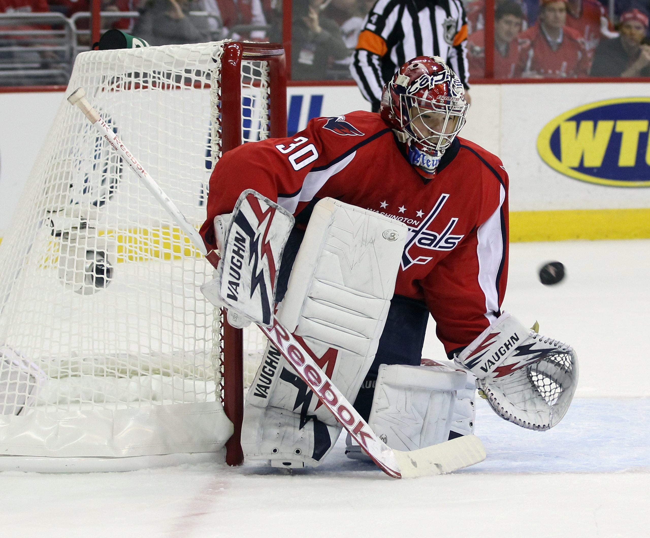 WASHINGTON, DC - APRIL 15: Michal Neuvirth #30 of the Washington Capitals makes the save against the New York Rangers in Game Two of the Eastern Conference Quarterfinals during the 2011 NHL Stanley Cup Playoffs at Verizon Center on April 15, 2011 in Wash WASHINGTON, DC - APRIL 15: Michal Neuvirth #30 of the Washington Capitals makes the save against the New York Rangers in Game Two of the Eastern Conference Quarterfinals during the 2011 NHL Stanley Cup Playoffs at Verizon Center on April 15, 2011 in Wash