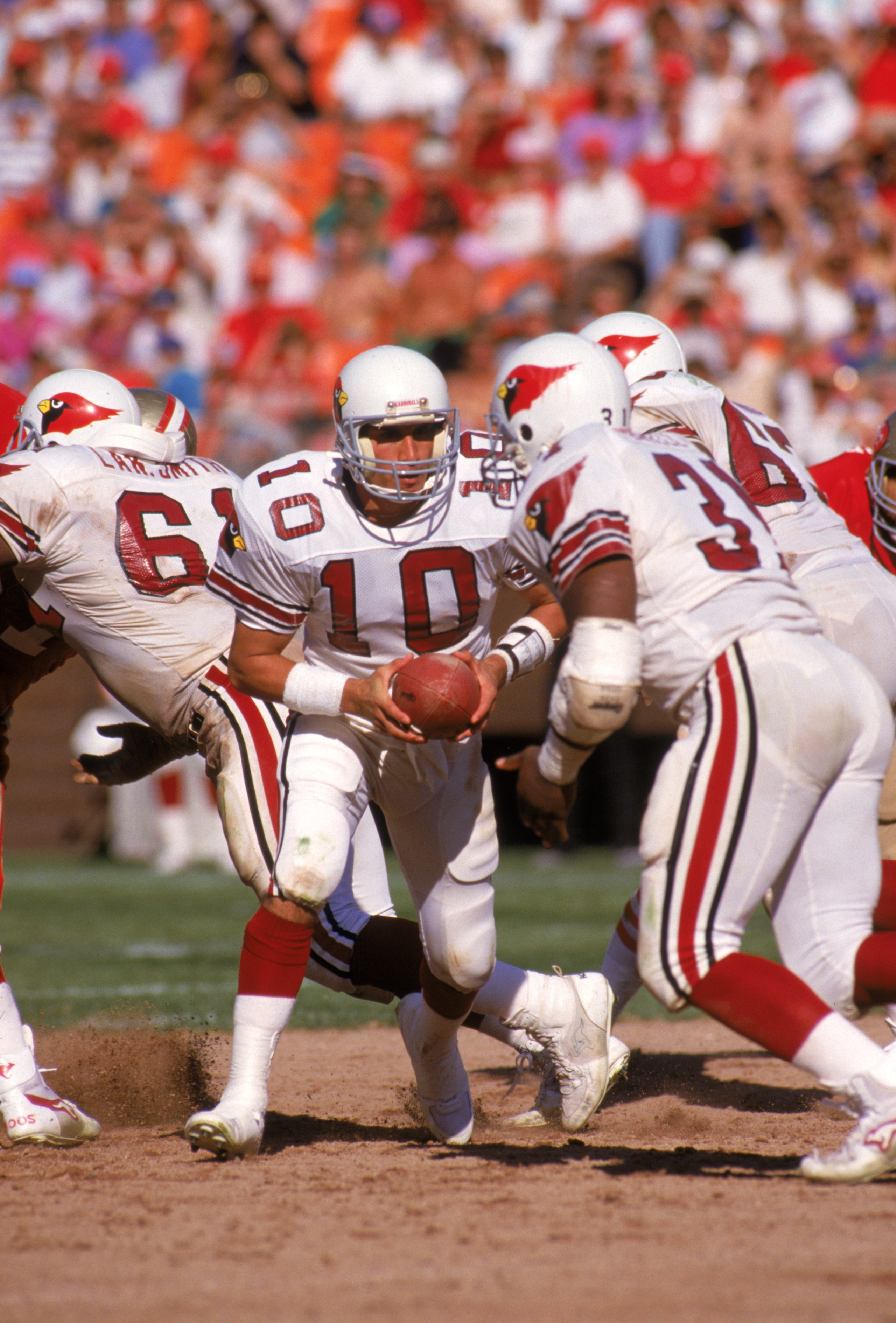 SAN FRANCISCO - OCTOBER 18: Quarterback Sammy Garza #10 of the St. Louis Cardinals runs a play during a game against the San Francisco 49ers at Candlestick Park on October 18, 1987 in San Francisco, California. The 49ers won 34-28. (Photo by George Ros SAN FRANCISCO - OCTOBER 18: Quarterback Sammy Garza #10 of the St. Louis Cardinals runs a play during a game against the San Francisco 49ers at Candlestick Park on October 18, 1987 in San Francisco, California. The 49ers won 34-28. (Photo by George Ros