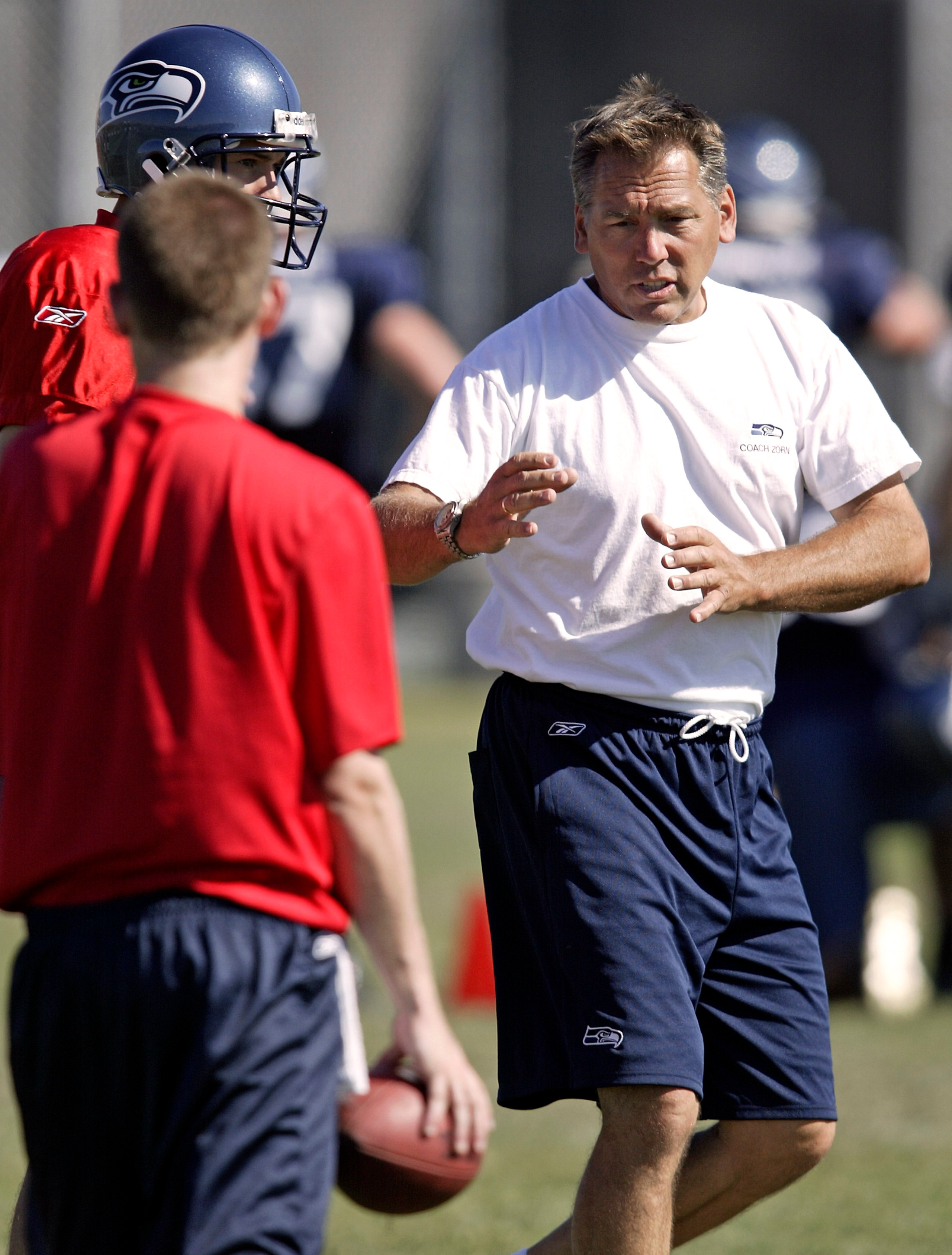 CHENEY, WA - AUGUST 3: Quarterback coach Jim Zorn (R) of the Seattle Seahawks gives instructions on a play during training camp at Eastern Washington University on August 3, 2005 in Cheney, Washington. (Photo by Jeff T. Green/Getty Images) CHENEY, WA - AUGUST 3: Quarterback coach Jim Zorn (R) of the Seattle Seahawks gives instructions on a play during training camp at Eastern Washington University on August 3, 2005 in Cheney, Washington. (Photo by Jeff T. Green/Getty Images)