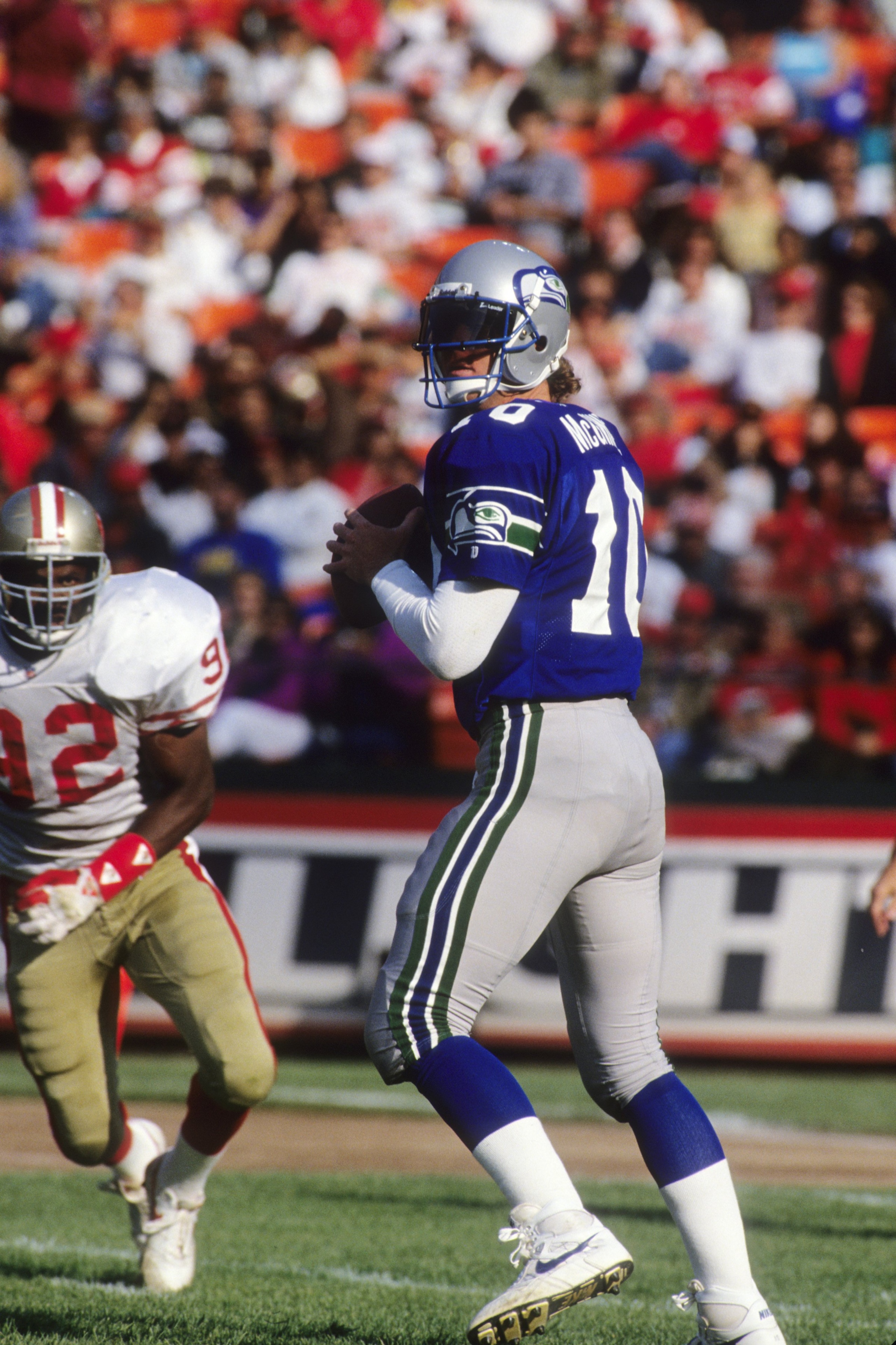 SAN FRANCISCO, CA - AUGUST 28: Quarterback Dan McGwire #10 of the Seattle Seahawks looks down field for a receiver during the exhibition game against the San Francisco 49ers at Candlestick Park on August 28, 1992 in San Francisco, California. The 49ers SAN FRANCISCO, CA - AUGUST 28: Quarterback Dan McGwire #10 of the Seattle Seahawks looks down field for a receiver during the exhibition game against the San Francisco 49ers at Candlestick Park on August 28, 1992 in San Francisco, California. The 49ers