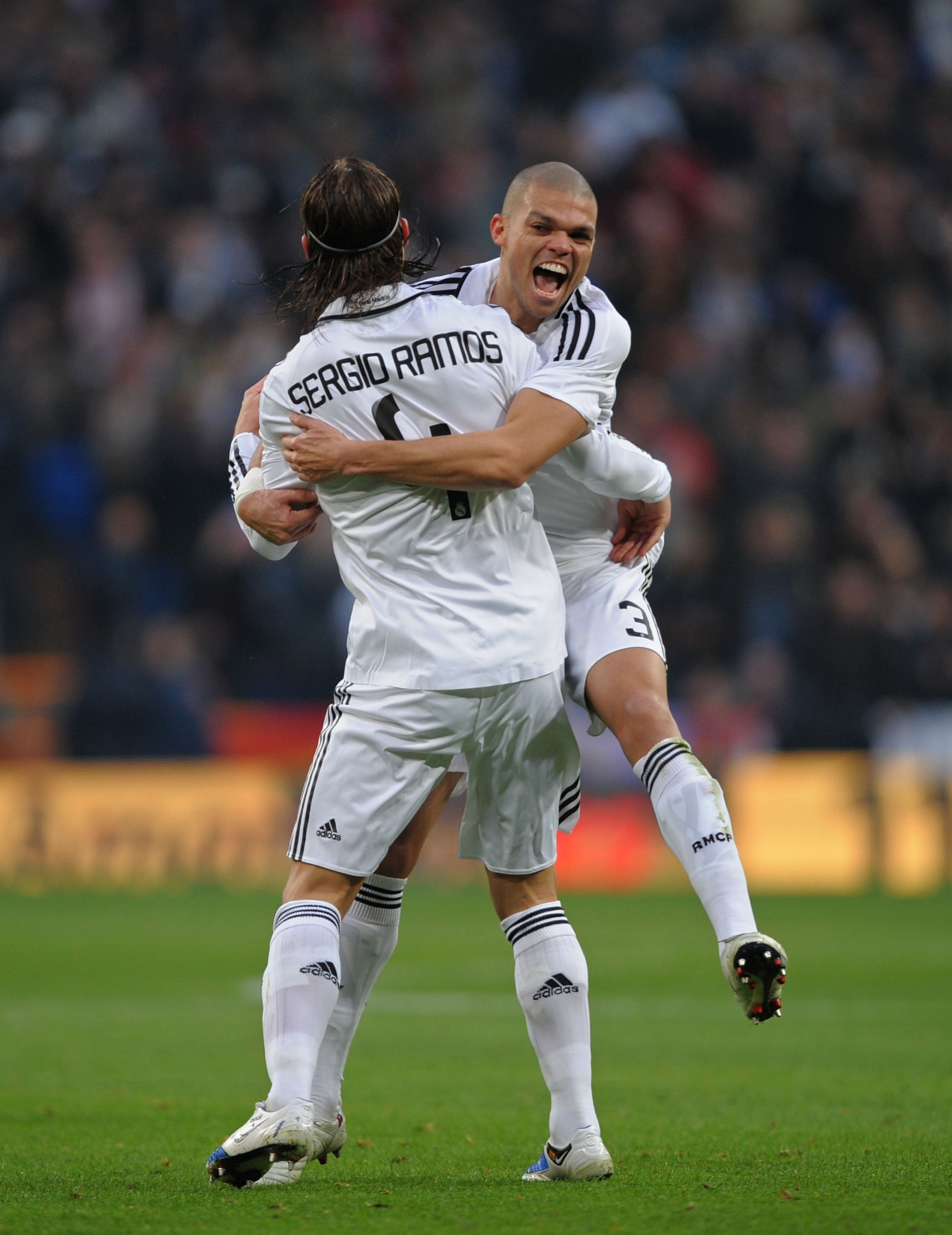 MADRID, SPAIN - JANUARY 18:  Sergio Ramos of Real Madrid celebrates with Pepe after scoring Real's first goal against Osasuna during the La Liga match between Real Madrid and Osasuna on January 18, 2009 in Madrid, Spain.  (Photo by Denis Doyle/Getty Image