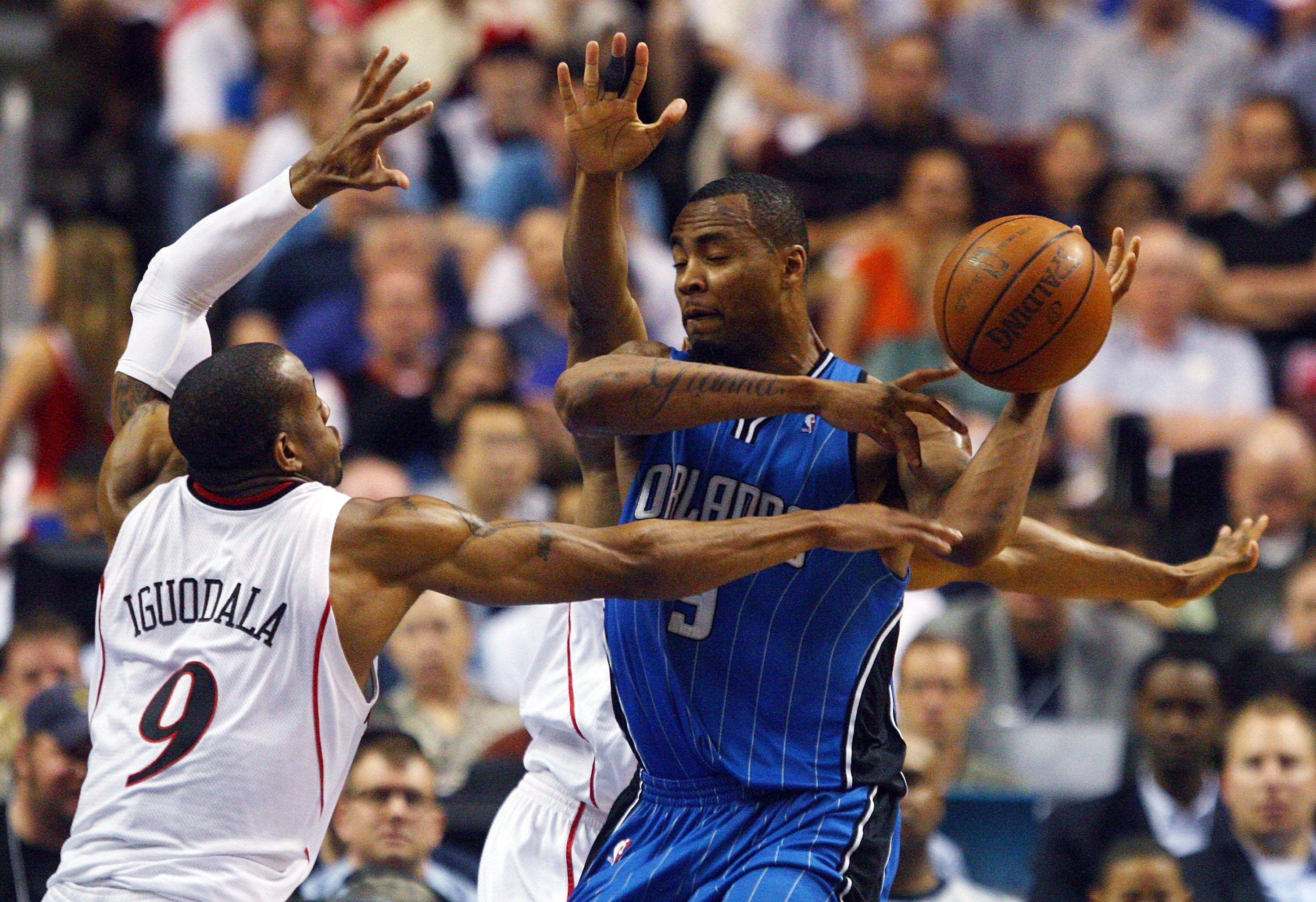 PHILADELPHIA - APRIL 26:  Andre Iguodala #9 of the Philadelphia 76ers defends against Rashard Lewis #9 of the Orlando Magic during Game Four of the Eastern Conference Quarterfinals during the 2009 NBA Playoffs at the Wachovia Center on April 26, 2009 in P