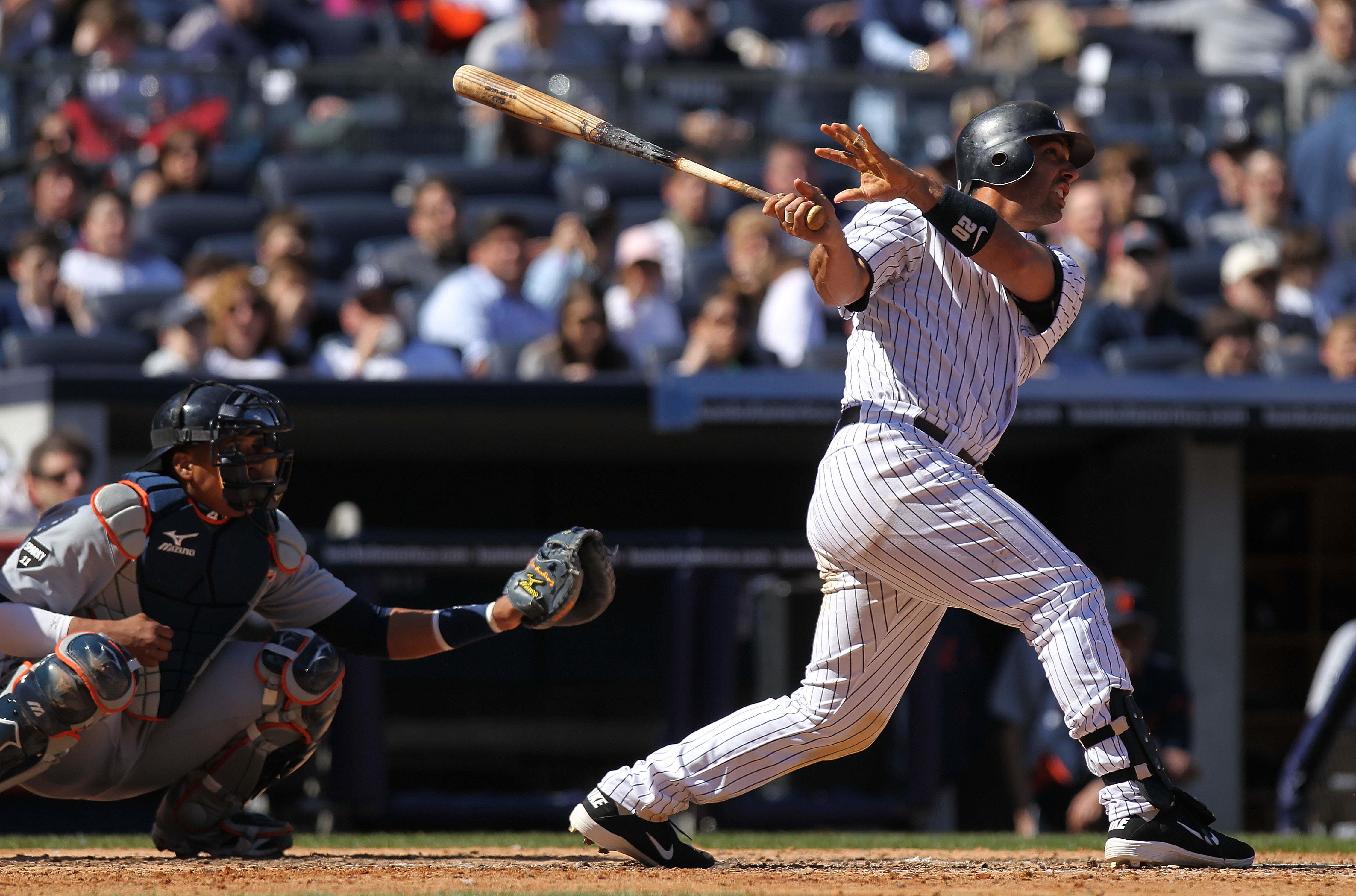 NEW YORK, NY - APRIL 03: Jorge Posada #20 of the New York Yankees hits his second homerun against the Detroit Tigers at Yankee Stadium on April 3, 2011 in the Bronx borough of New York City.  (Photo by Nick Laham/Getty Images)
