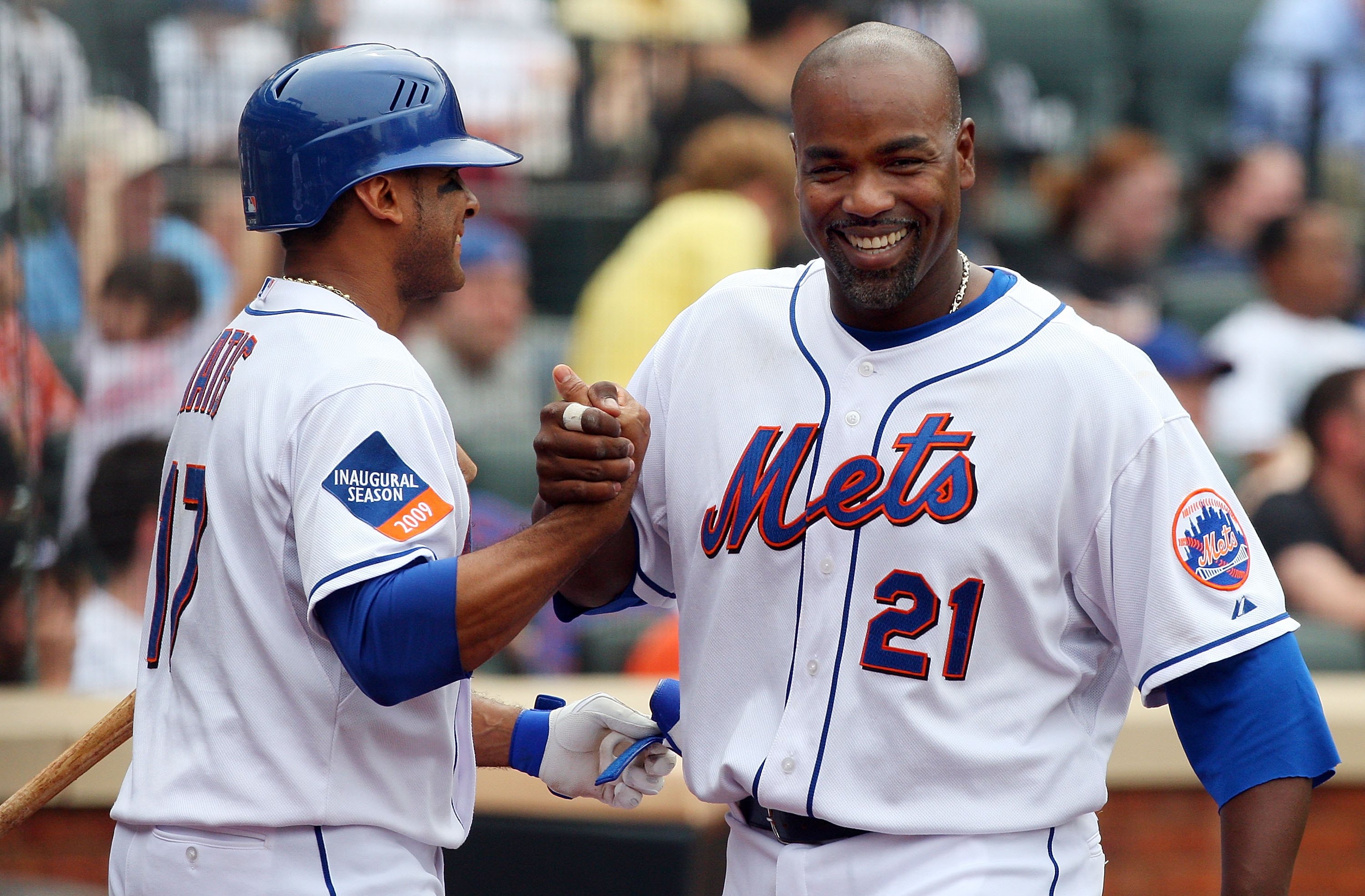 NEW YORK - MAY 09:  Carlos Delgado #21 of the New York Mets celebrates with teammate Fernando Tatis #17 after scoring a run against the Pittsburgh Pirates on May 9, 2009 at Citi Field in the Flushing neighborhood of the Queens borough of New York City. Th