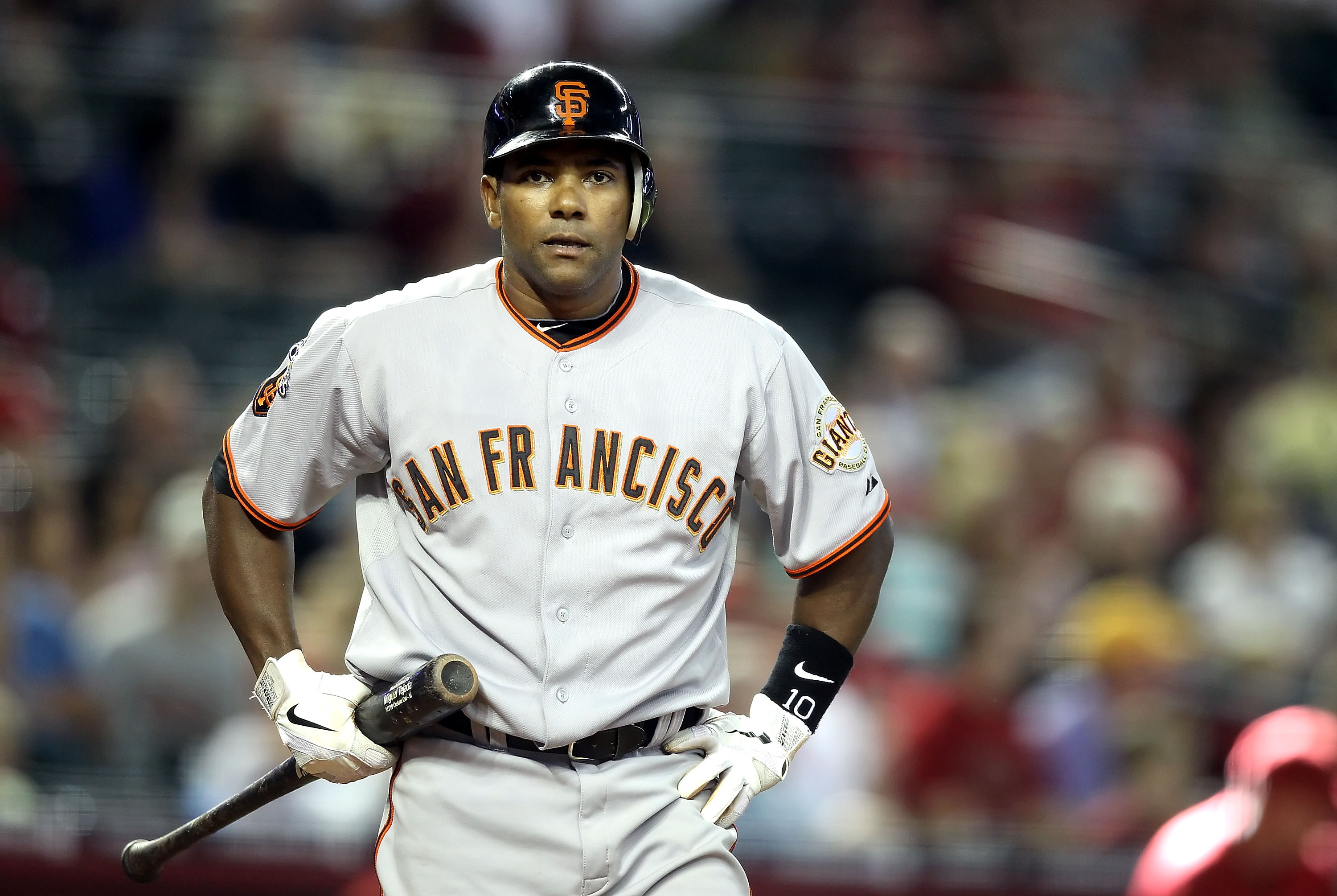 PHOENIX, AZ - APRIL 17:  Miguel Tejada #10 of the San Francisco Giants reacts to a called strike during the Major League Baseball game against the Arizona Diamondbacks at Chase Field on April 17, 2011 in Phoenix, Arizona. The Diamondbacks defeated the Gia