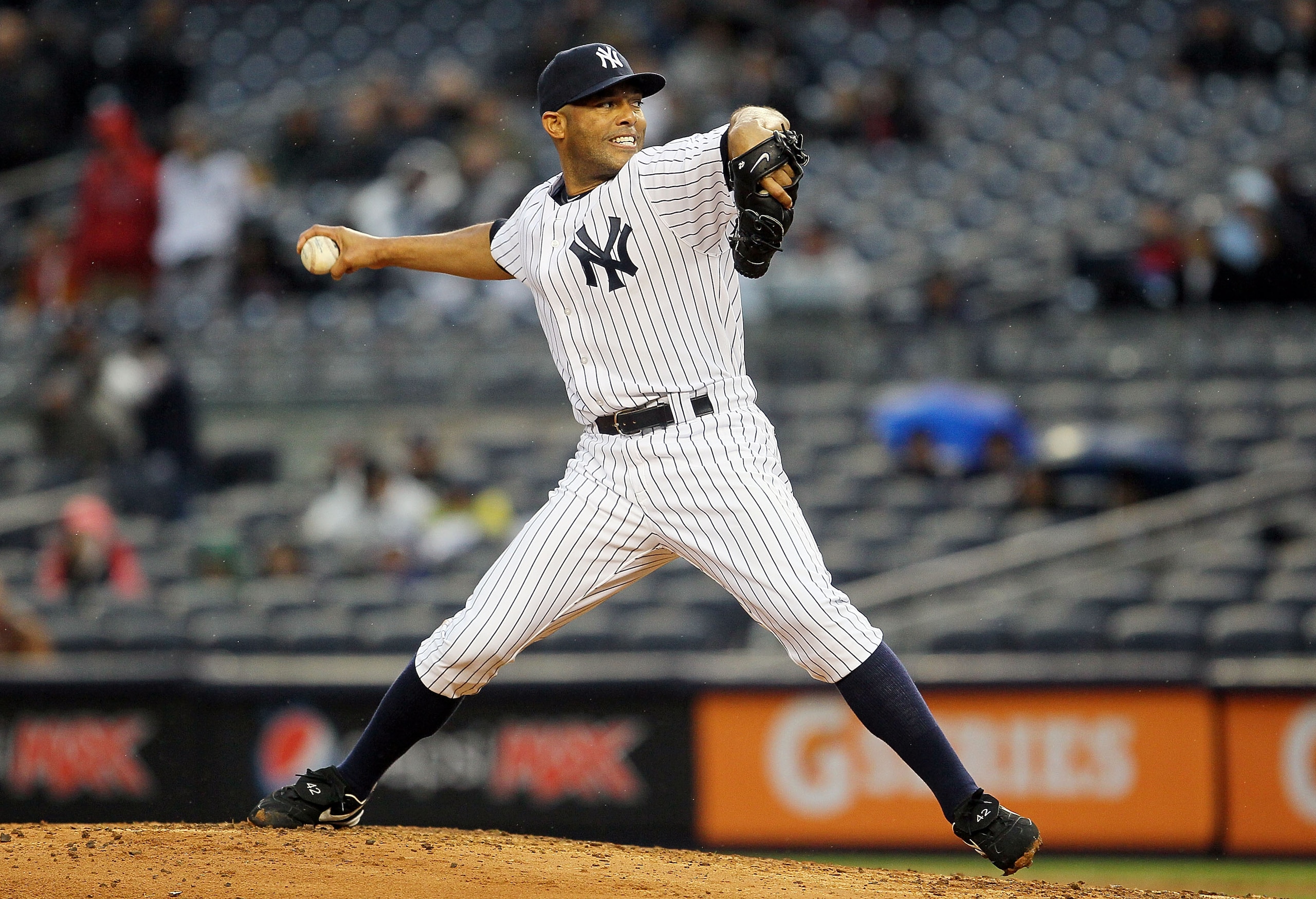 NEW YORK, NY - APRIL 16:  Mariano Rivera #42 of the New York Yankees delivers a ninth-inning pitch against the Texas Rangers on April 16, 2011 at Yankee Stadium in the Bronx borough of New York City. The Yankees defeated the Rangers 5-2.  (Photo by Jim Mc