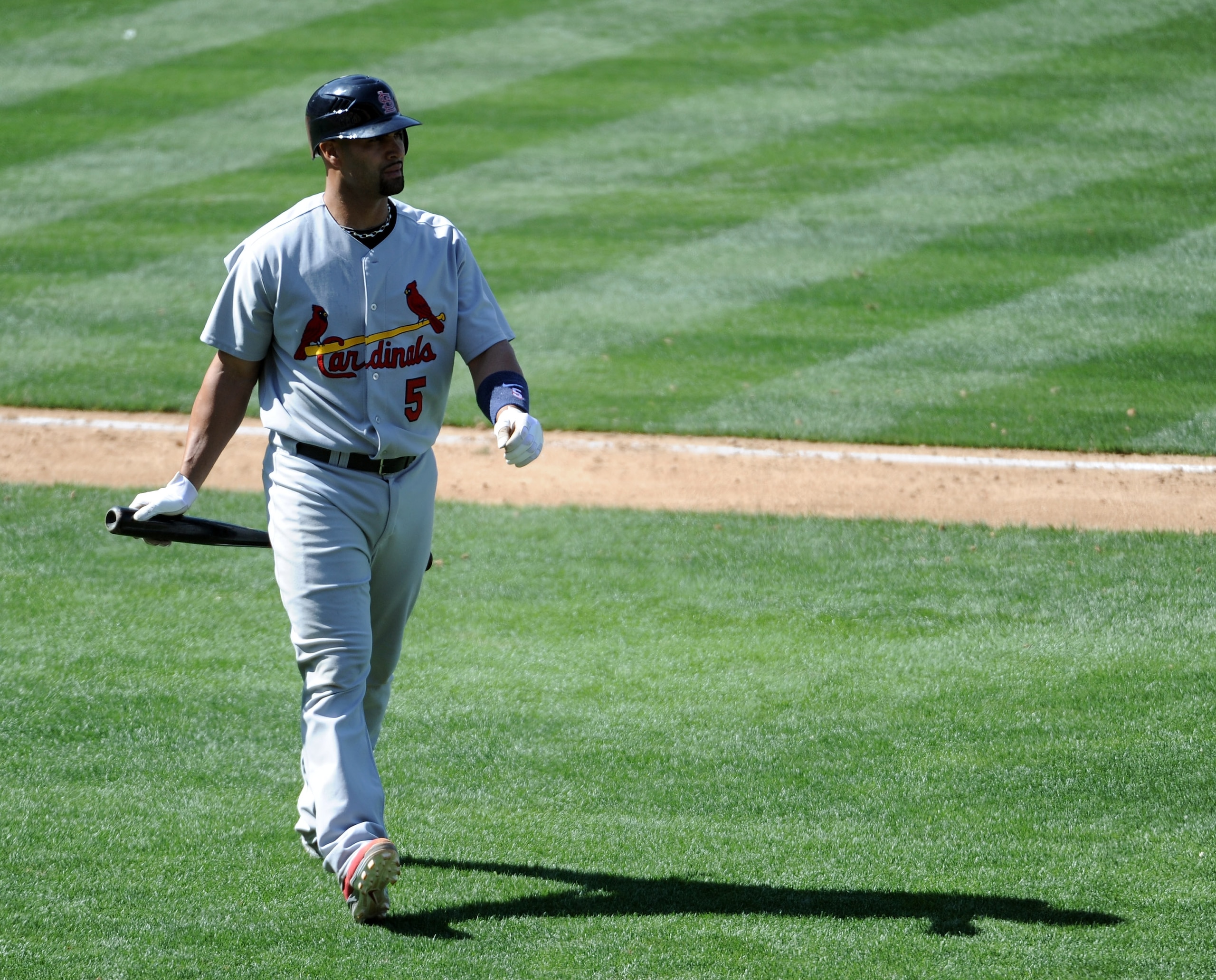 LOS ANGELES, CA - APRIL 17: Albert Pujols #5 of the St. Louis Cardinals walks off the field after a strikeout against the Los Angeles Dodgers at Dodger Stadium on April 17, 2011 in Los Angeles, California.  (Photo by Harry How/Getty Images)