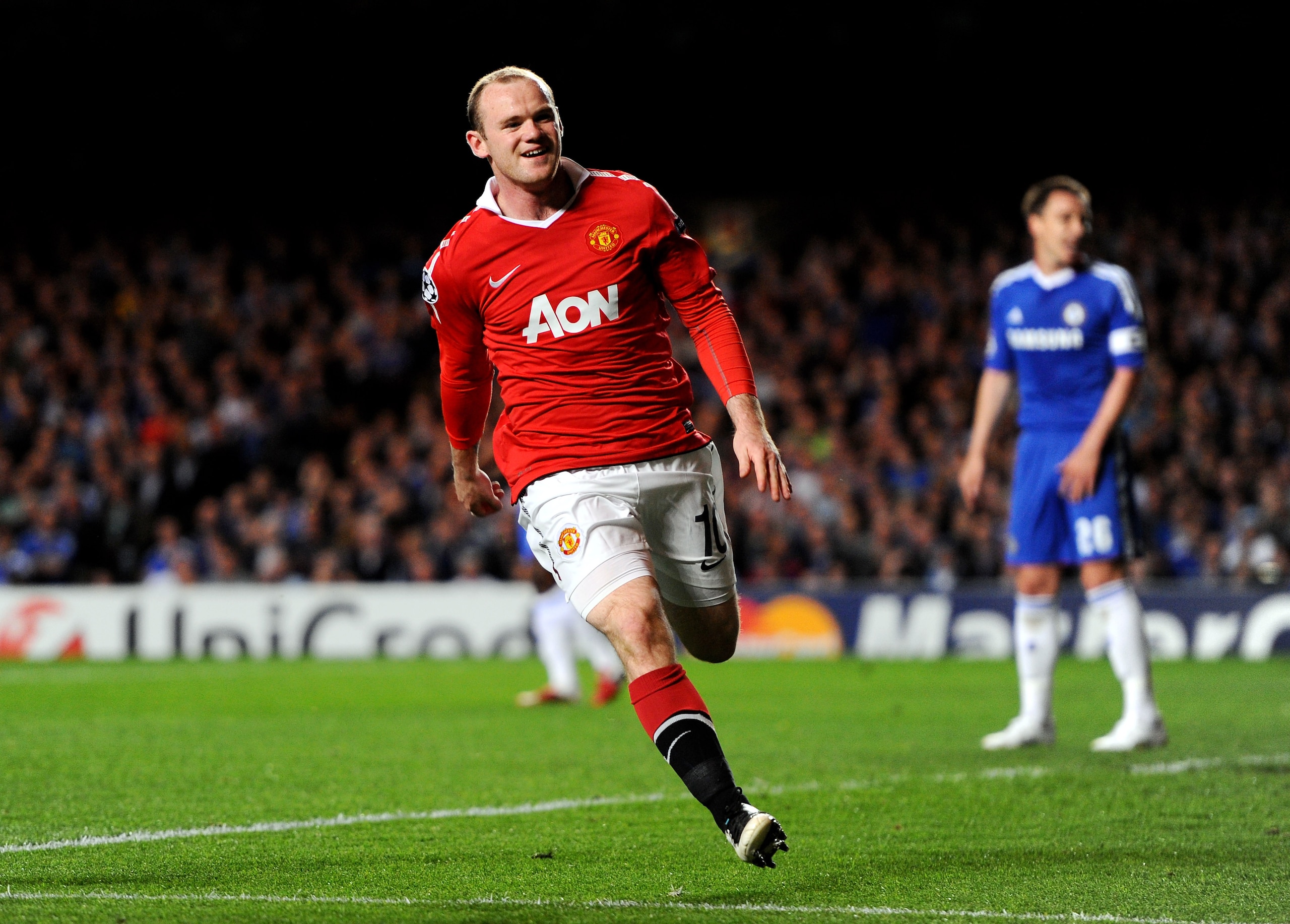 LONDON, ENGLAND - APRIL 06: Wayne Rooney of Manchester United celebrates after scoring the opening goal during the UEFA Champions League quarter final first leg match between Chelsea and Manchester United at Stamford Bridge on April 6, 2011 in London, En LONDON, ENGLAND - APRIL 06: Wayne Rooney of Manchester United celebrates after scoring the opening goal during the UEFA Champions League quarter final first leg match between Chelsea and Manchester United at Stamford Bridge on April 6, 2011 in London, En