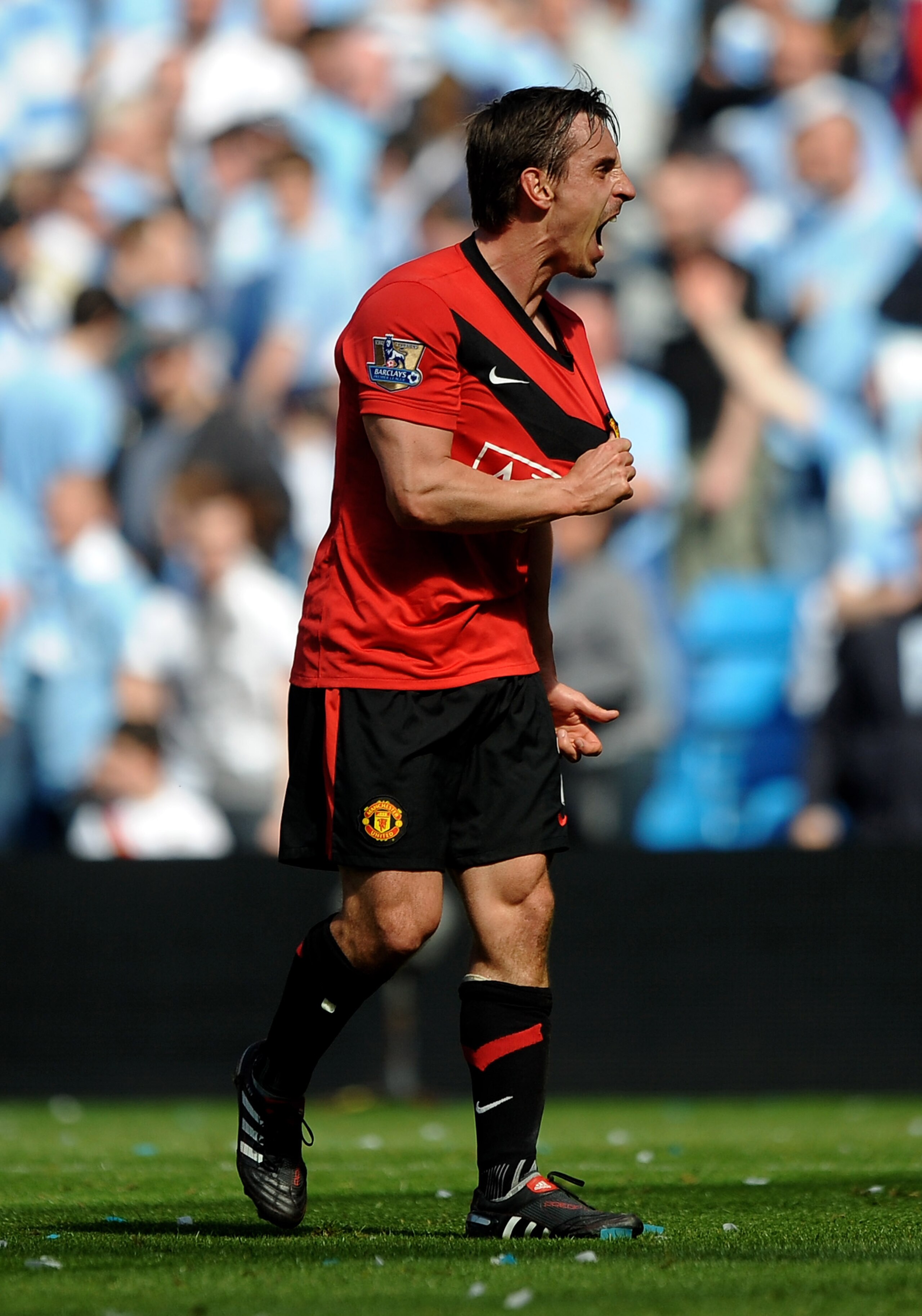 MANCHESTER, UNITED KINGDOM - APRIL 17: Gary Neville of Manchester United celebrates at the end of the Barclays Premier League match between Manchester City and Manchester United at the City of Manchester Stadium on April 17, 2010 in Manchester, England. MANCHESTER, UNITED KINGDOM - APRIL 17: Gary Neville of Manchester United celebrates at the end of the Barclays Premier League match between Manchester City and Manchester United at the City of Manchester Stadium on April 17, 2010 in Manchester, England.