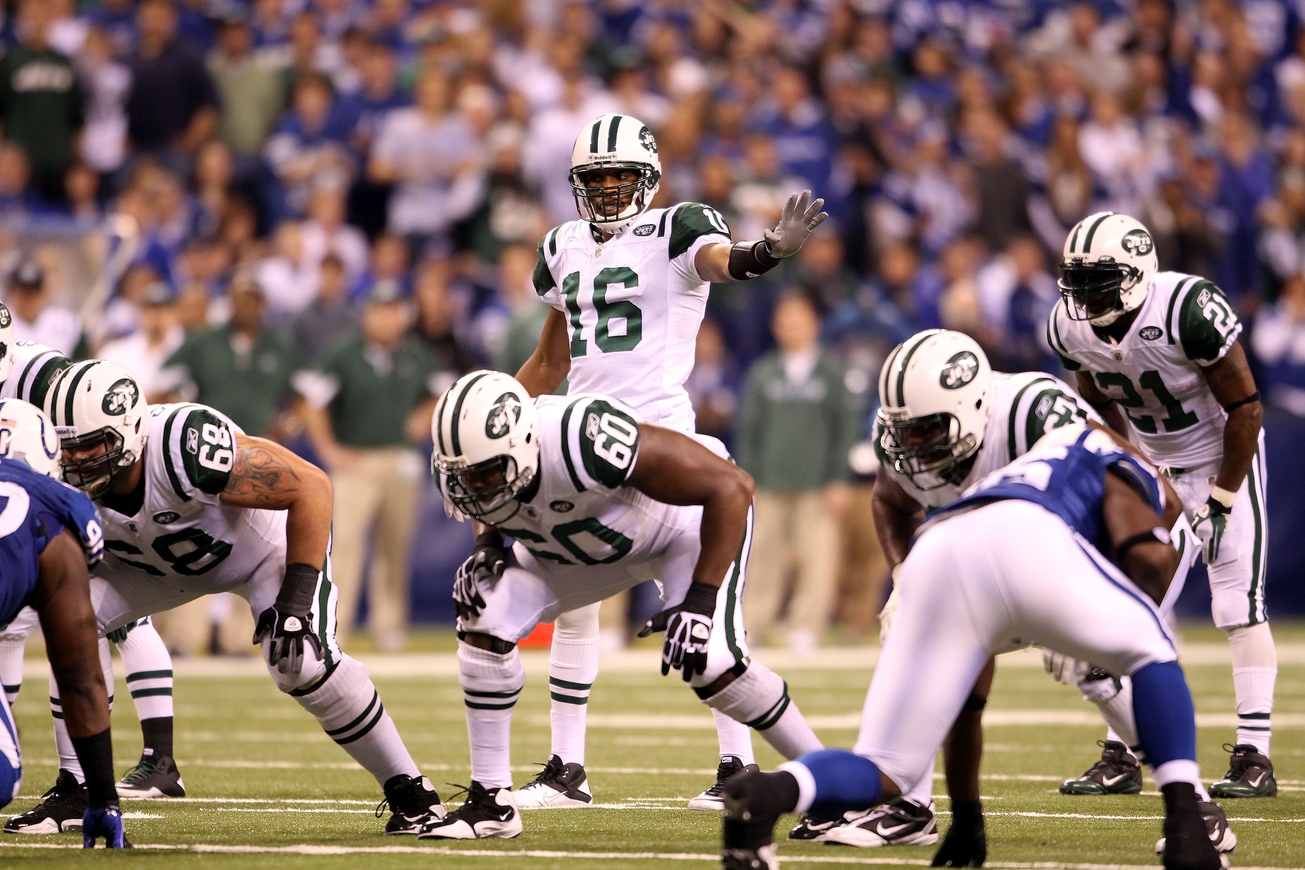INDIANAPOLIS, IN - JANUARY 08:  Brad Smith #16 of the New York Jets gestures as he lines up in the wildcat formation at quarterback against the Indianapolis Colts during their 2011 AFC wild card playoff game at Lucas Oil Stadium on January 8, 2011 in Indi