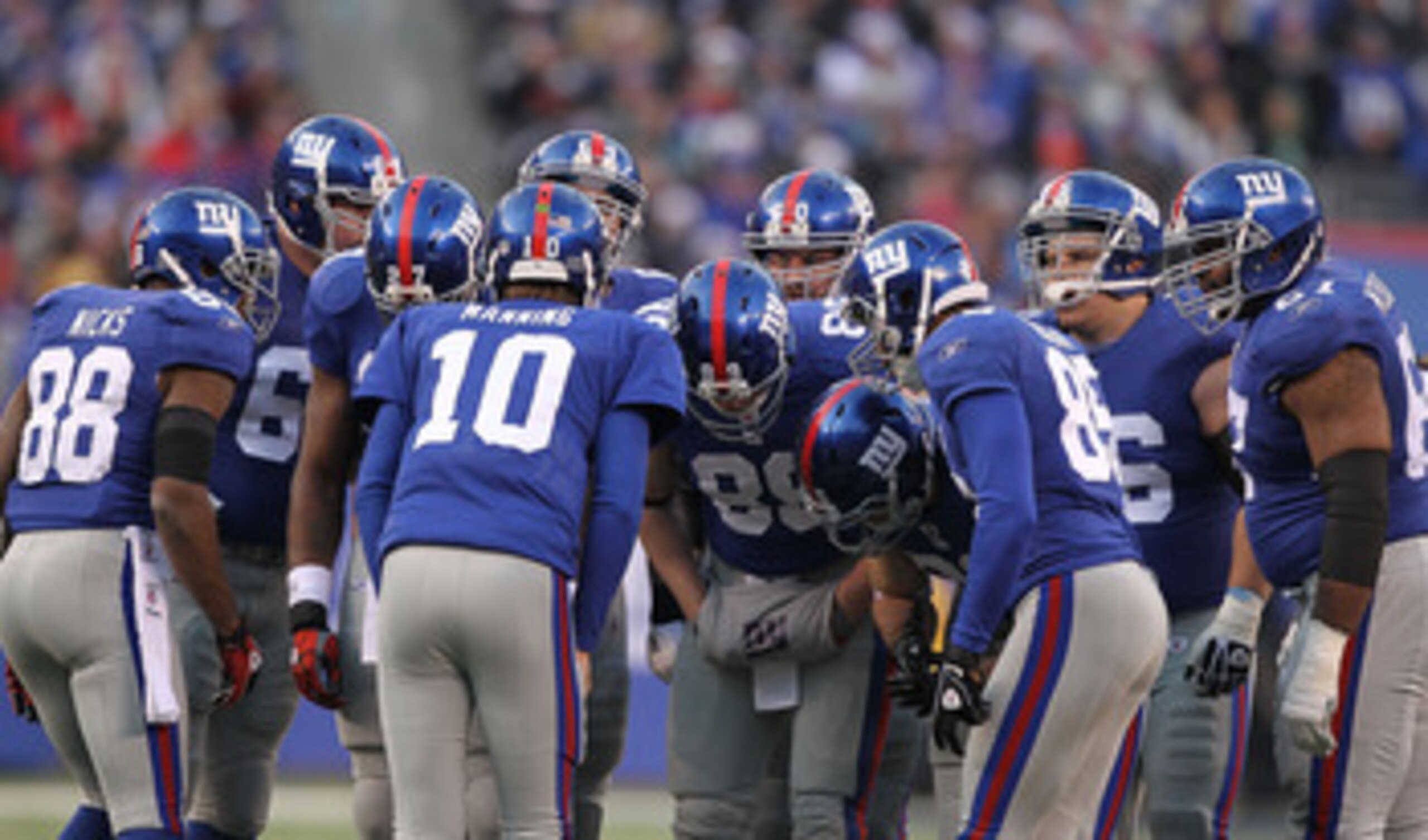 EAST RUTHERFORD, NJ - DECEMBER 19: Eli Manning #10 of the New York Giantscalls the huddle against the Philadelphia Eagles during their game on December 19, 2010 at The New Meadowlands Stadium in East Rutherford, New Jersey. (Photo by Al Bello/Getty Ima EAST RUTHERFORD, NJ - DECEMBER 19: Eli Manning #10 of the New York Giantscalls the huddle against the Philadelphia Eagles during their game on December 19, 2010 at The New Meadowlands Stadium in East Rutherford, New Jersey. (Photo by Al Bello/Getty Ima