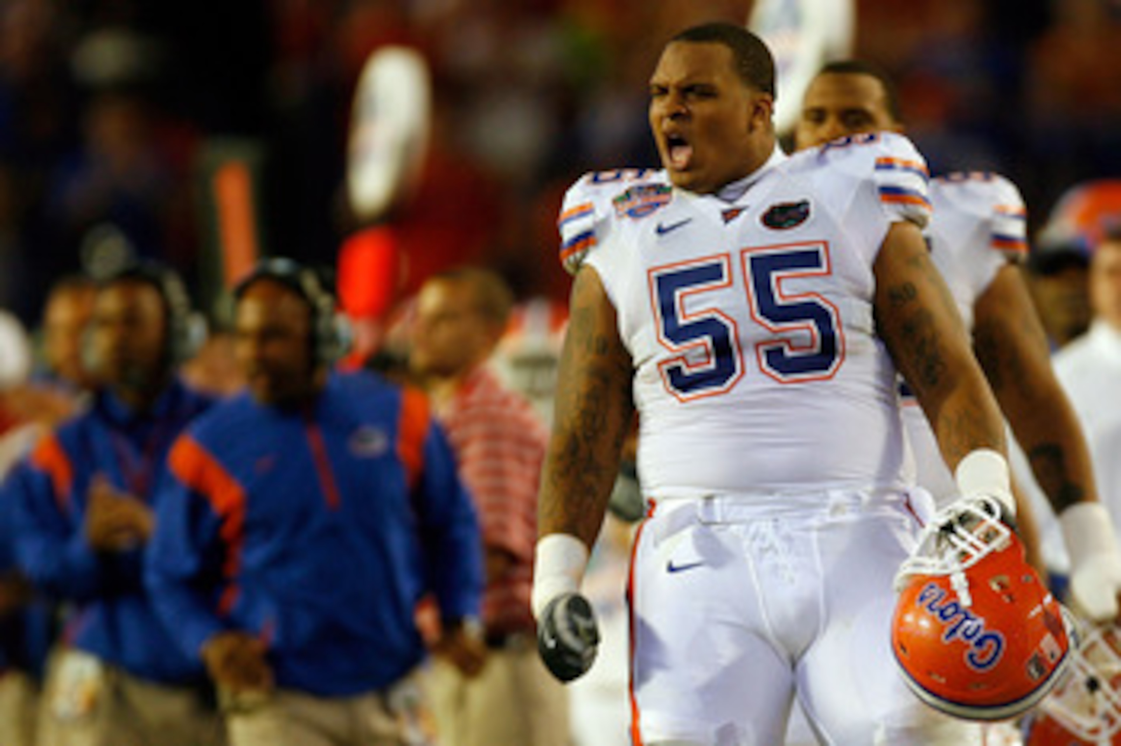 MIAMI - JANUARY 08: Mike Pouncey #55 of the Florida Gators reacts after a play against the Oklahoma Sooners in the FedEx BCS National Championship Game at Dolphin Stadium on January 8, 2009 in Miami, Florida.  (Photo by Eliot J. Schechter/Getty Images)