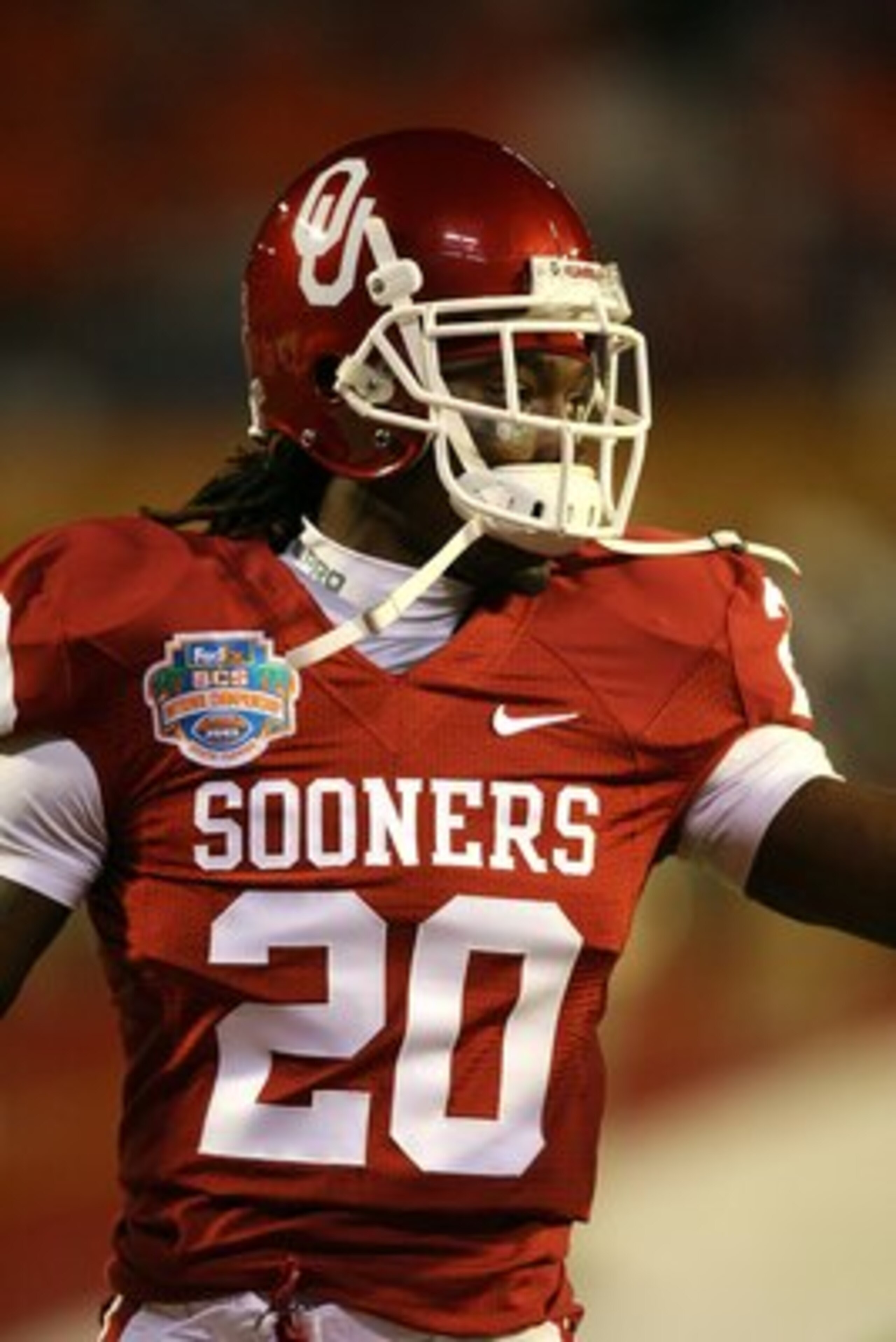 MIAMI - JANUARY 08: Quinton Carter #20 of the Oklahoma Sooners looks on during warm ups against the Florida Gators during the FedEx BCS National Championship game at Dolphin Stadium on January 8, 2009 in Miami, Florida. (Photo by Doug Benc/Getty Images) MIAMI - JANUARY 08: Quinton Carter #20 of the Oklahoma Sooners looks on during warm ups against the Florida Gators during the FedEx BCS National Championship game at Dolphin Stadium on January 8, 2009 in Miami, Florida. (Photo by Doug Benc/Getty Images)
