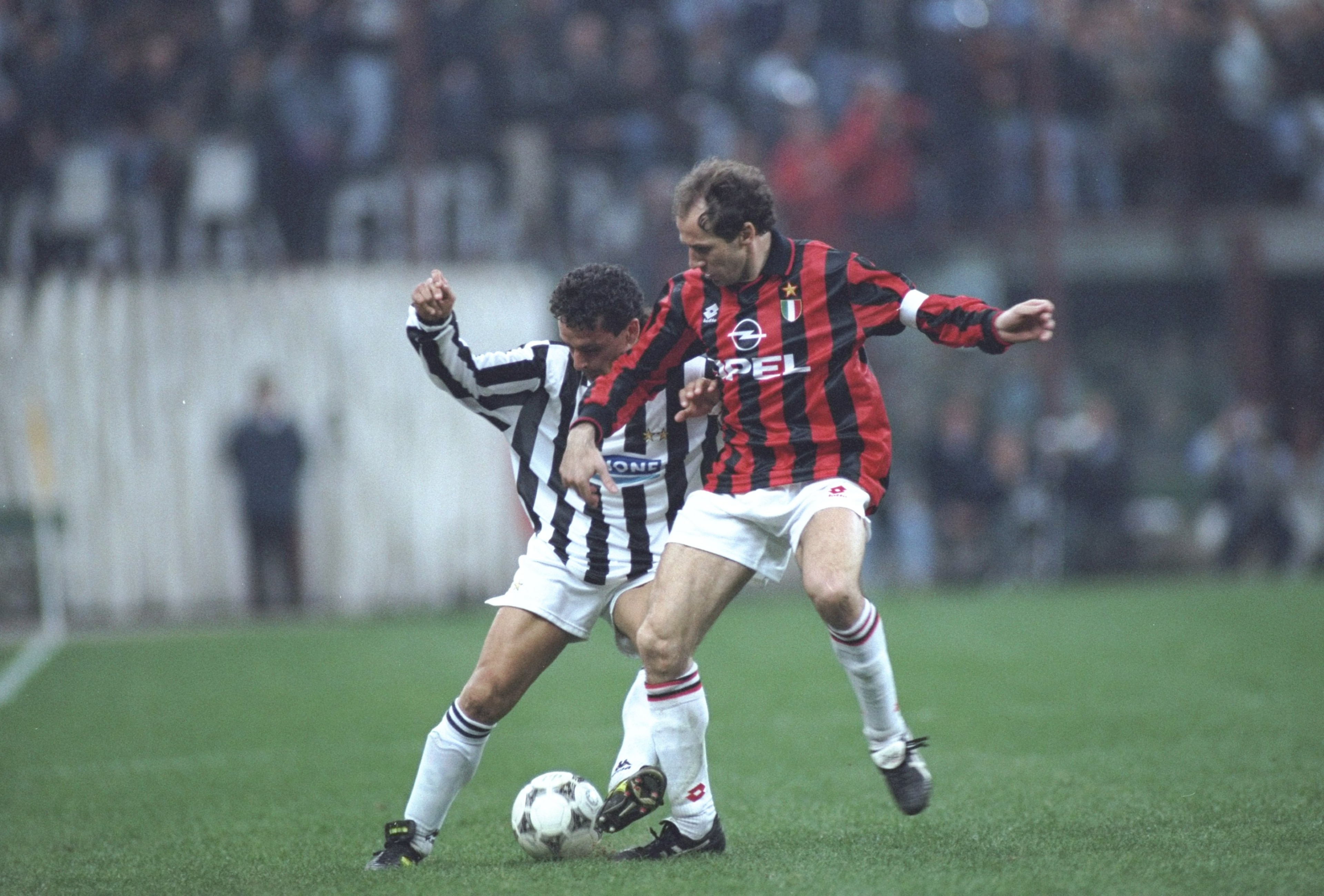 1 Apr 1995: Robertio Baggio (left) of Juventus takes on Franco Baresi (right) of AC Milan during a Serie A match at the San Siro Stadium in Milan, Italy. Juventus won the match 2-0. \ Mandatory Credit: Allsport UK /Allsport 1 Apr 1995: Robertio Baggio (left) of Juventus takes on Franco Baresi (right) of AC Milan during a Serie A match at the San Siro Stadium in Milan, Italy. Juventus won the match 2-0. \ Mandatory Credit: Allsport UK /Allsport