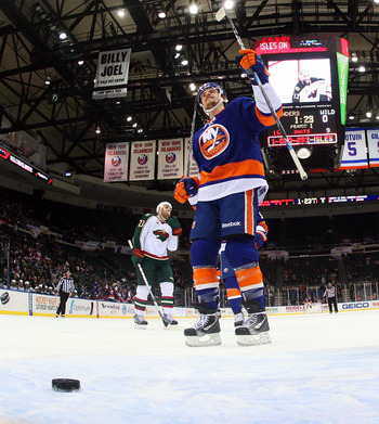 UNIONDALE, NY - MARCH 02: Michael Grabner #40 of the New York Islanders celebrates a goal against the Minnesota Wild at the Nassau Coliseum on March 2, 2011 in Uniondale, New York. The Islanders defeated the Wild 4-1.  (Photo by Bruce Bennett/Getty Images
