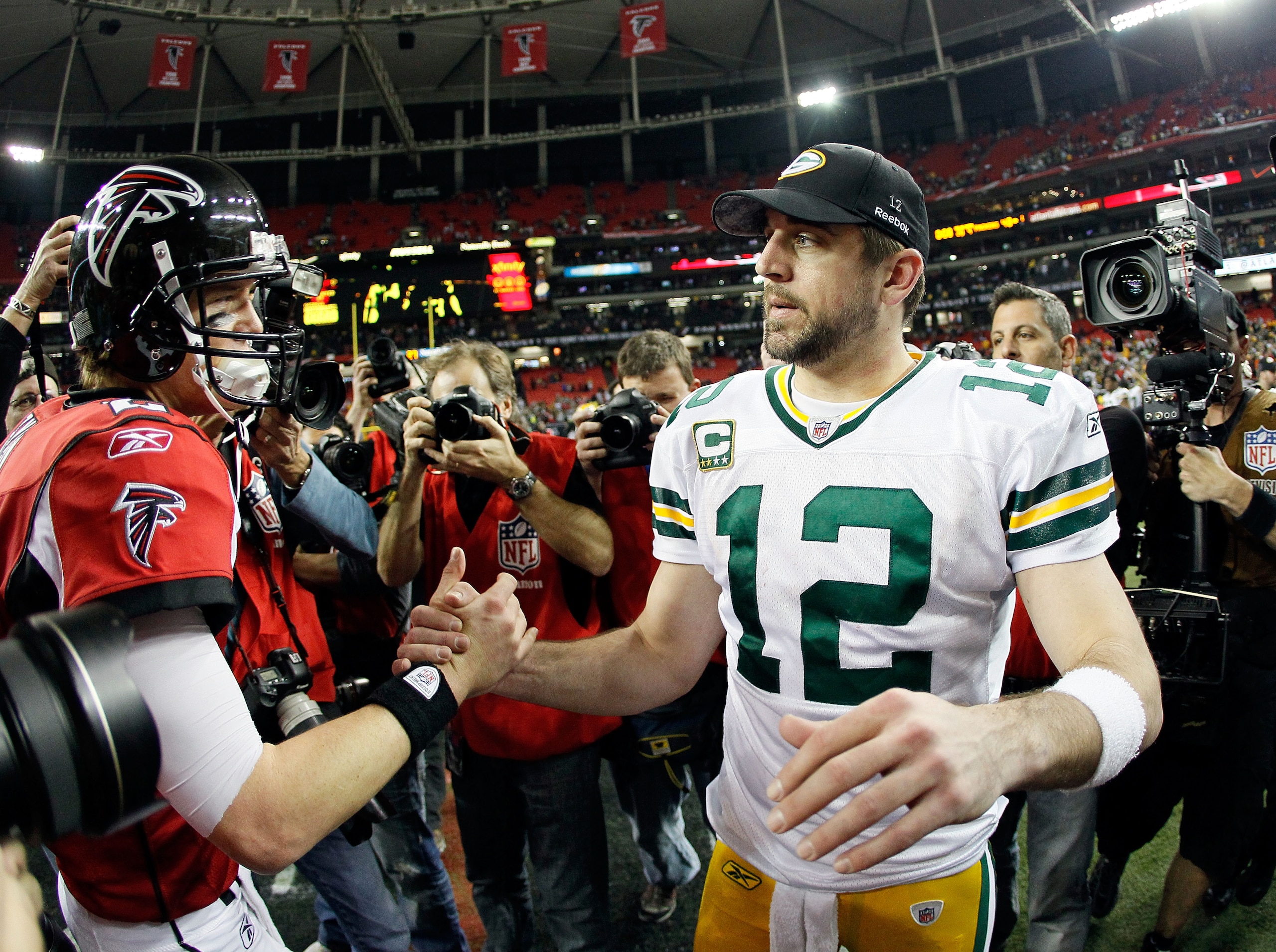 ATLANTA, GA - JANUARY 15:  Quarterback Aaron Rodgers #12 (R) of the Green Bay Packers is congratulated by Matt Ryan #2 of the Atlanta Falcons after the Packers won 48-21 during their 2011 NFC divisional playoff game at Georgia Dome on January 15, 2011 in