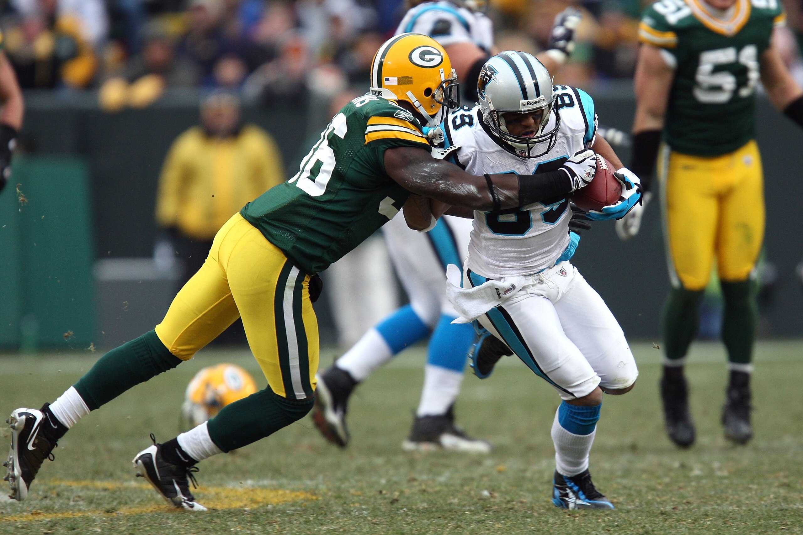 GREEN BAY, WI - NOVEMBER 30:  Steve Smith #89 of  the Carolina Panthers runs for yards after the catch against Nick Collins #36 of the Green Bay Packers at Lambeau Field on November 30, 2008 in Green Bay, Wisconsin. The Panthers won 35-31.  (Photo by Jona