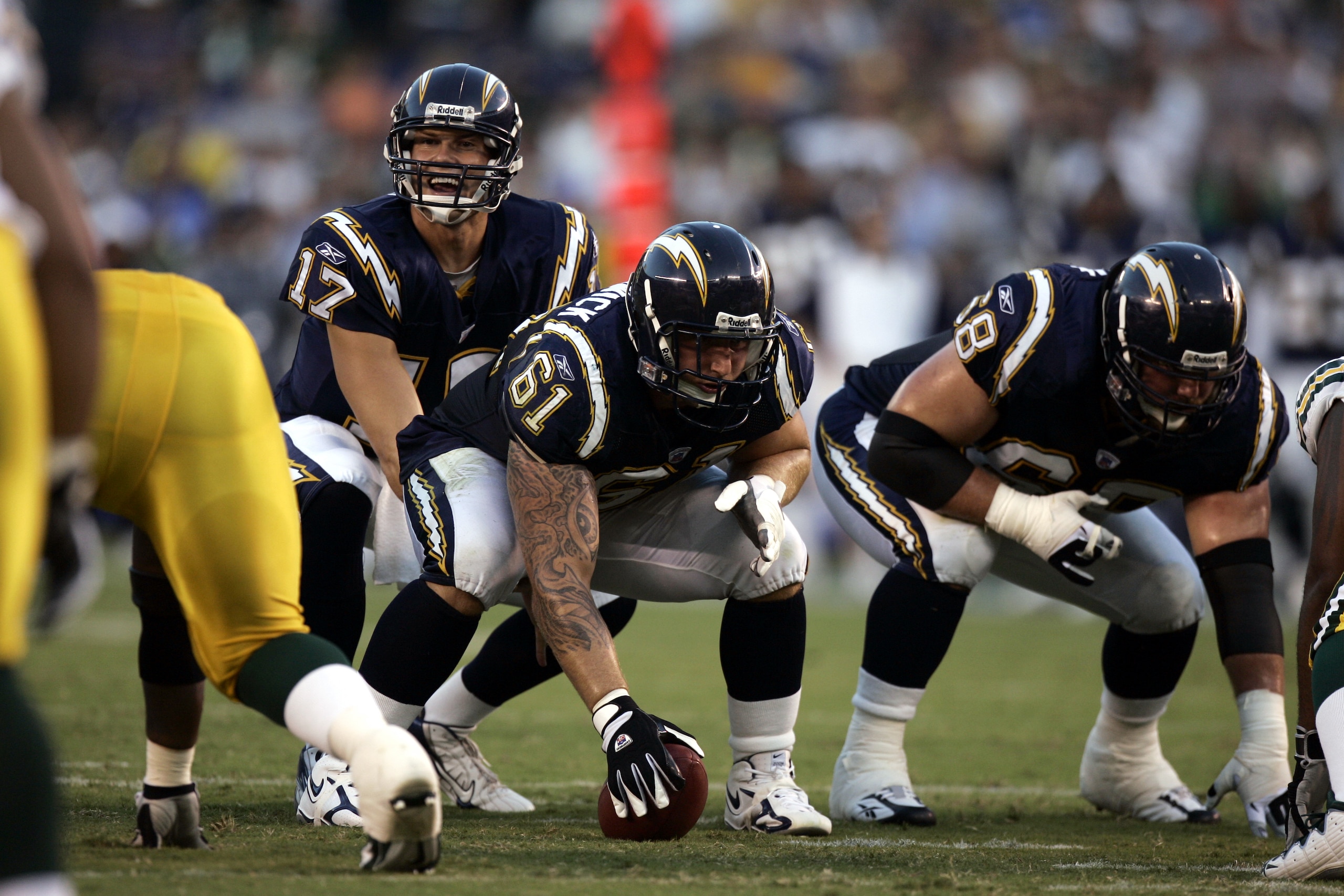 SAN DIEGO - AUGUST 12:  Quarterback Philip Rivers #17 of the San Diego Chargers waits for the snap from center Nick Hardwick #61 during the preseason game against the Green Bay Packers on August 12, 2006 at Qualcomm Stadium in San Diego, California. The C