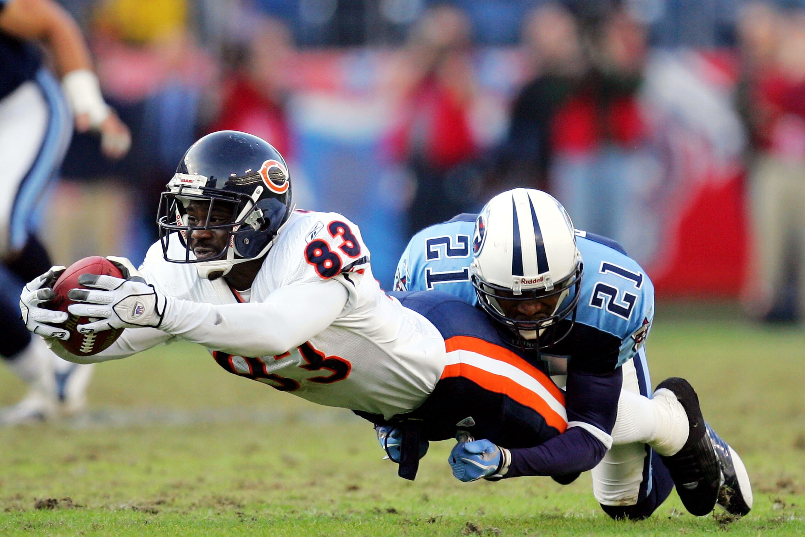 NASHVILLE - NOVEMBER 14: Wide receiver David Terrell #83 of the Chicago Bears stretches for the first down while tackled by Samari Rolle #21 of the Tennessee Titans on November 14, 2004 at The Coliseum in Nashville, Tennessee. The Bears defeated the Tita NASHVILLE - NOVEMBER 14: Wide receiver David Terrell #83 of the Chicago Bears stretches for the first down while tackled by Samari Rolle #21 of the Tennessee Titans on November 14, 2004 at The Coliseum in Nashville, Tennessee. The Bears defeated the Tita