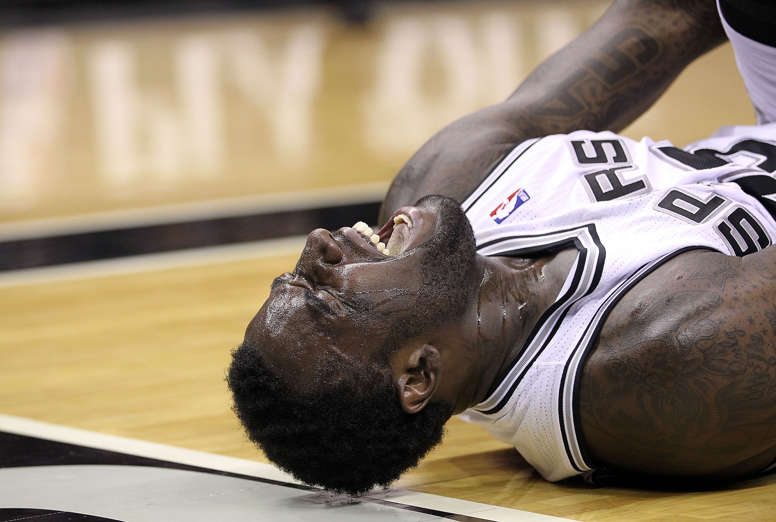 SAN ANTONIO, TX - APRIL 17:  Forward DeJuan Blair #45 of the San Antonio Spurs reacts against the Memphis Grizzlies in Game One of the Western Conference Quarterfinals in the 2011 NBA Playoffs on April 17, 2011 at AT&T Center in San Antonio, Texas.  NOTE 