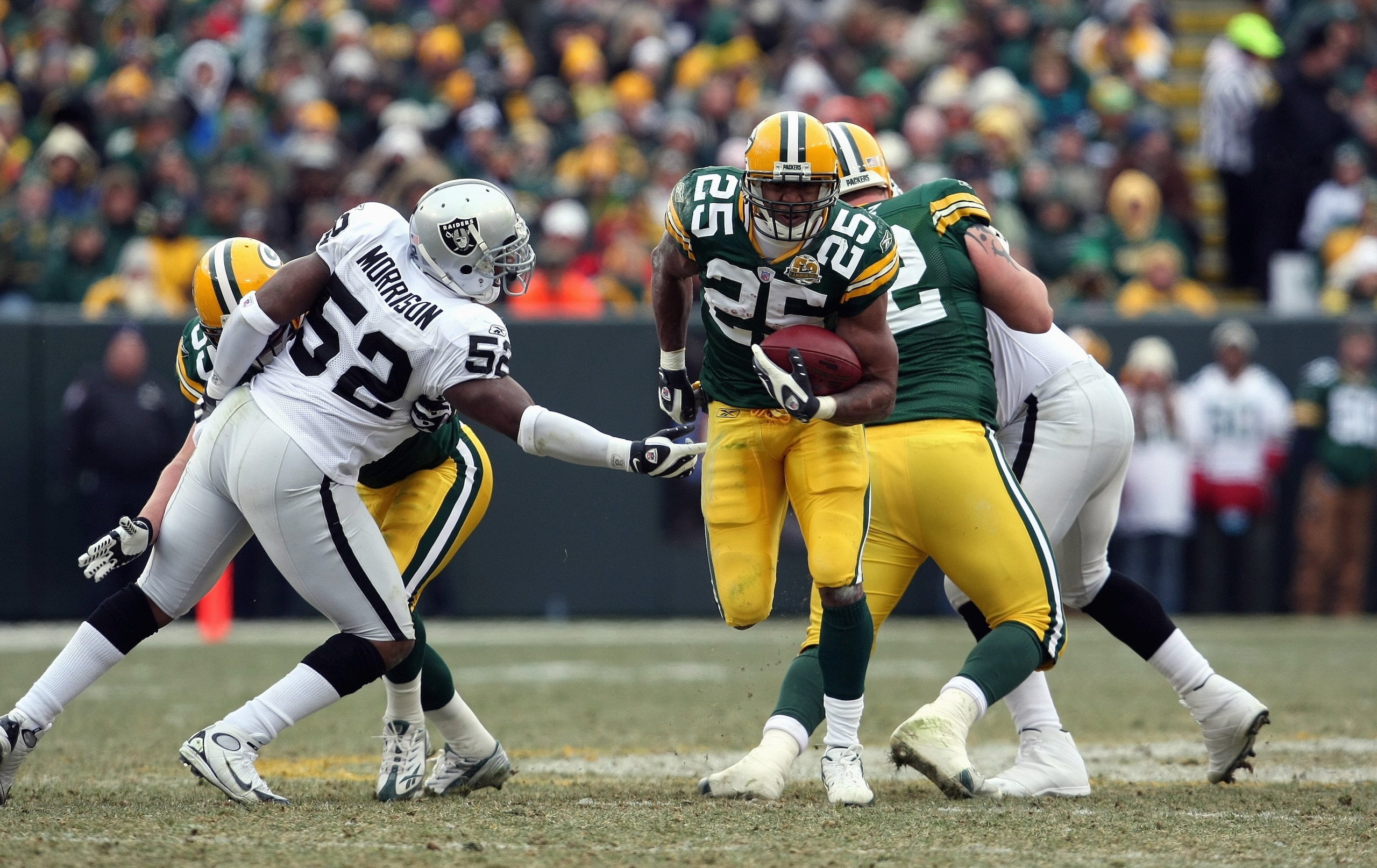 GREEN BAY, WI - DECEMBER 09: Ryan Grant #25 of the Green Bay Packers carries the ball against the Oakland Raiders on December 9, 2007 at Lambeau Field in Green Bay, Wisconsin. The Packers defeated the Raiders 38-7 to win the NFC North Division title. (Pho
