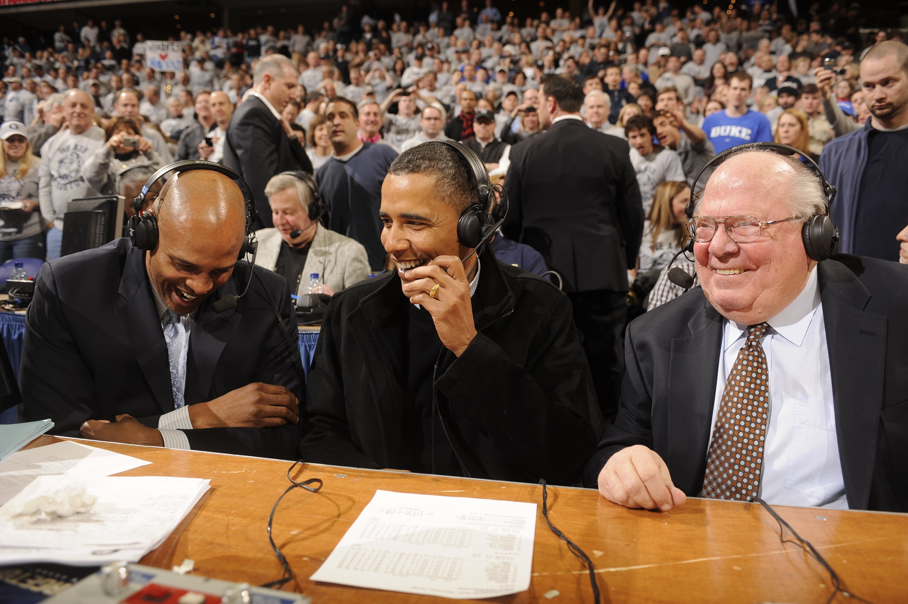 WASHINGTON - JANUARY 30:  President of the United States Barack Obama talks to CBS annoucers Clark Kellogg and Verne Lundquist during a college basketball game between Georgetown Hoyas and the Duke Blue Devils on January 30, 2010 at the Verizon Center in 