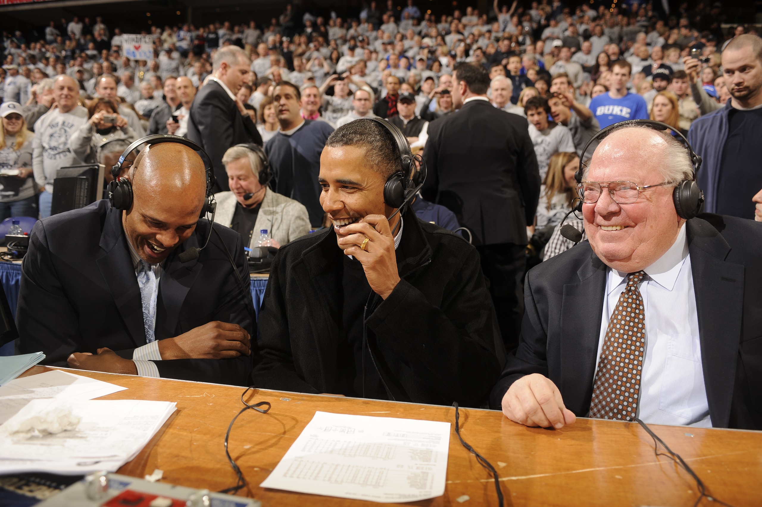 WASHINGTON - JANUARY 30: President of the United States Barack Obama talks to CBS annoucers Clark Kellogg and Verne Lundquist during a college basketball game between Georgetown Hoyas and the Duke Blue Devils on January 30, 2010 at the Verizon Center in WASHINGTON - JANUARY 30: President of the United States Barack Obama talks to CBS annoucers Clark Kellogg and Verne Lundquist during a college basketball game between Georgetown Hoyas and the Duke Blue Devils on January 30, 2010 at the Verizon Center in
