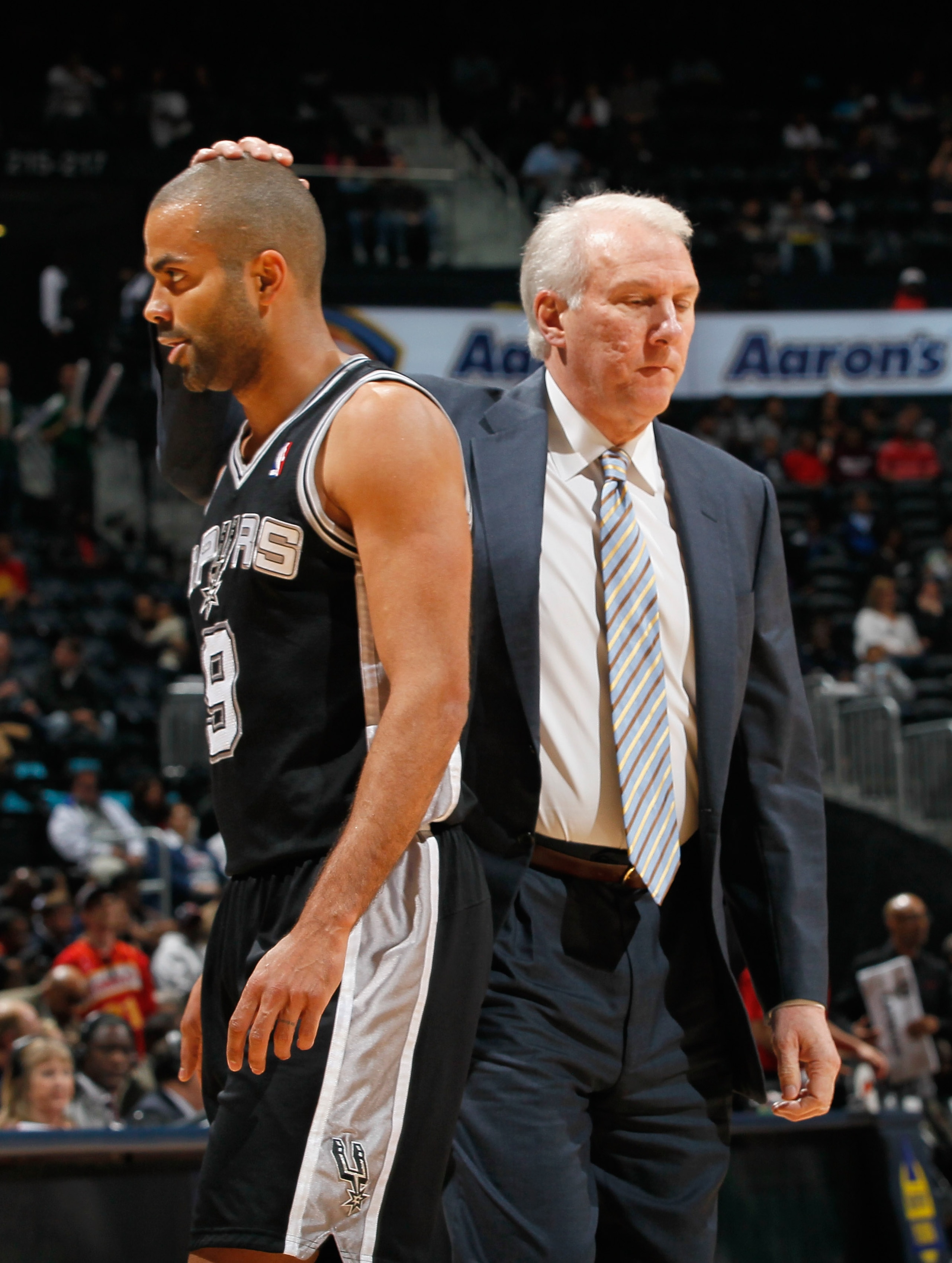 ATLANTA, GA - APRIL 05: Tony Parker #9 and head coach Gregg Popovich of the San Antonio Spurs against the Atlanta Hawks at Philips Arena on April 5, 2011 in Atlanta, Georgia. NOTE TO USER: User expressly acknowledges and agrees that, by downloading and/ ATLANTA, GA - APRIL 05: Tony Parker #9 and head coach Gregg Popovich of the San Antonio Spurs against the Atlanta Hawks at Philips Arena on April 5, 2011 in Atlanta, Georgia. NOTE TO USER: User expressly acknowledges and agrees that, by downloading and/