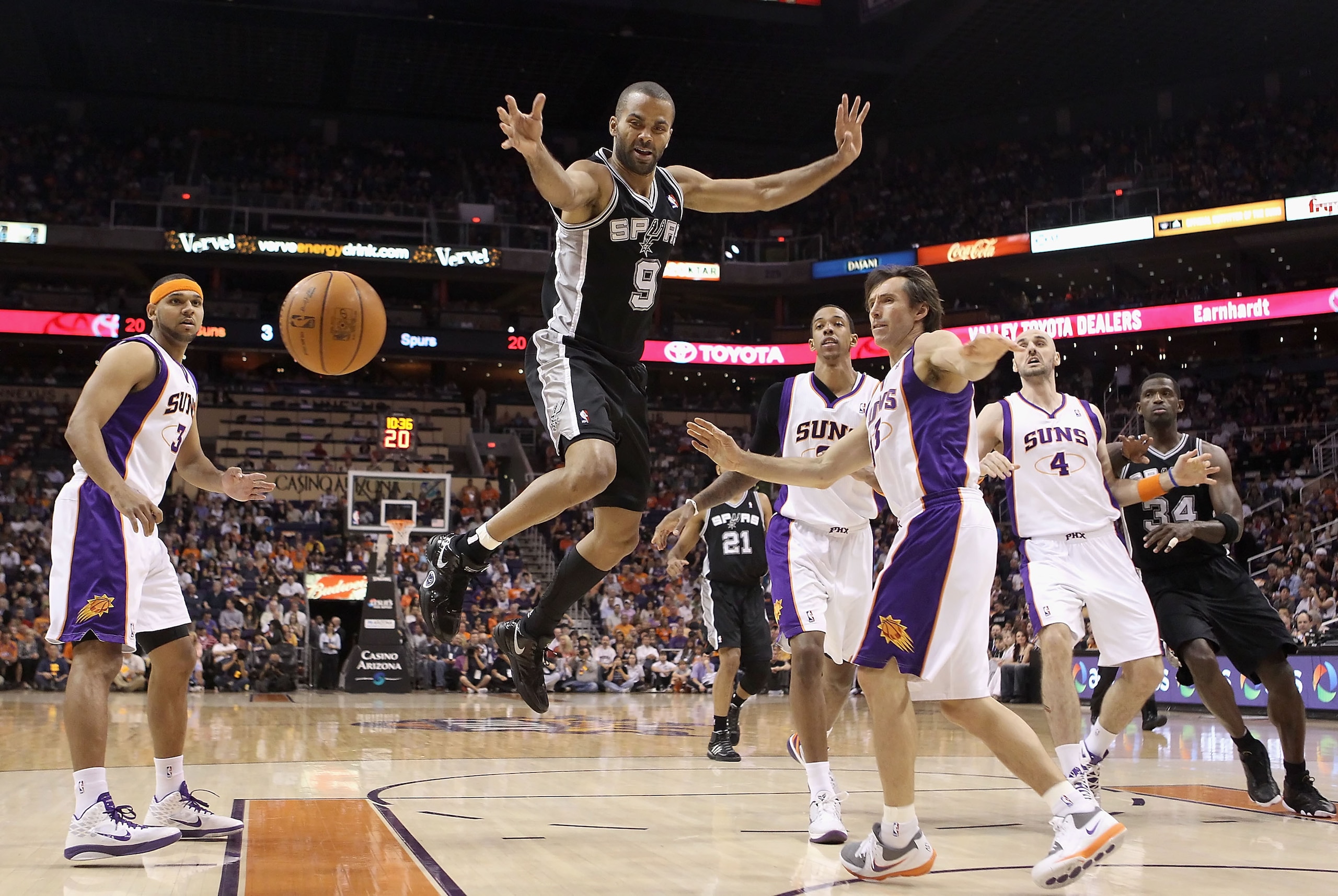 PHOENIX, AZ - APRIL 13: Tony Parker #9 of the San Antonio Spurs looses the ball as he drives to the net past Steve Nash #13 of the Phoenix Suns during the NBA game at US Airways Center on April 13, 2011 in Phoenix, Arizona. NOTE TO USER: User expressly PHOENIX, AZ - APRIL 13: Tony Parker #9 of the San Antonio Spurs looses the ball as he drives to the net past Steve Nash #13 of the Phoenix Suns during the NBA game at US Airways Center on April 13, 2011 in Phoenix, Arizona. NOTE TO USER: User expressly