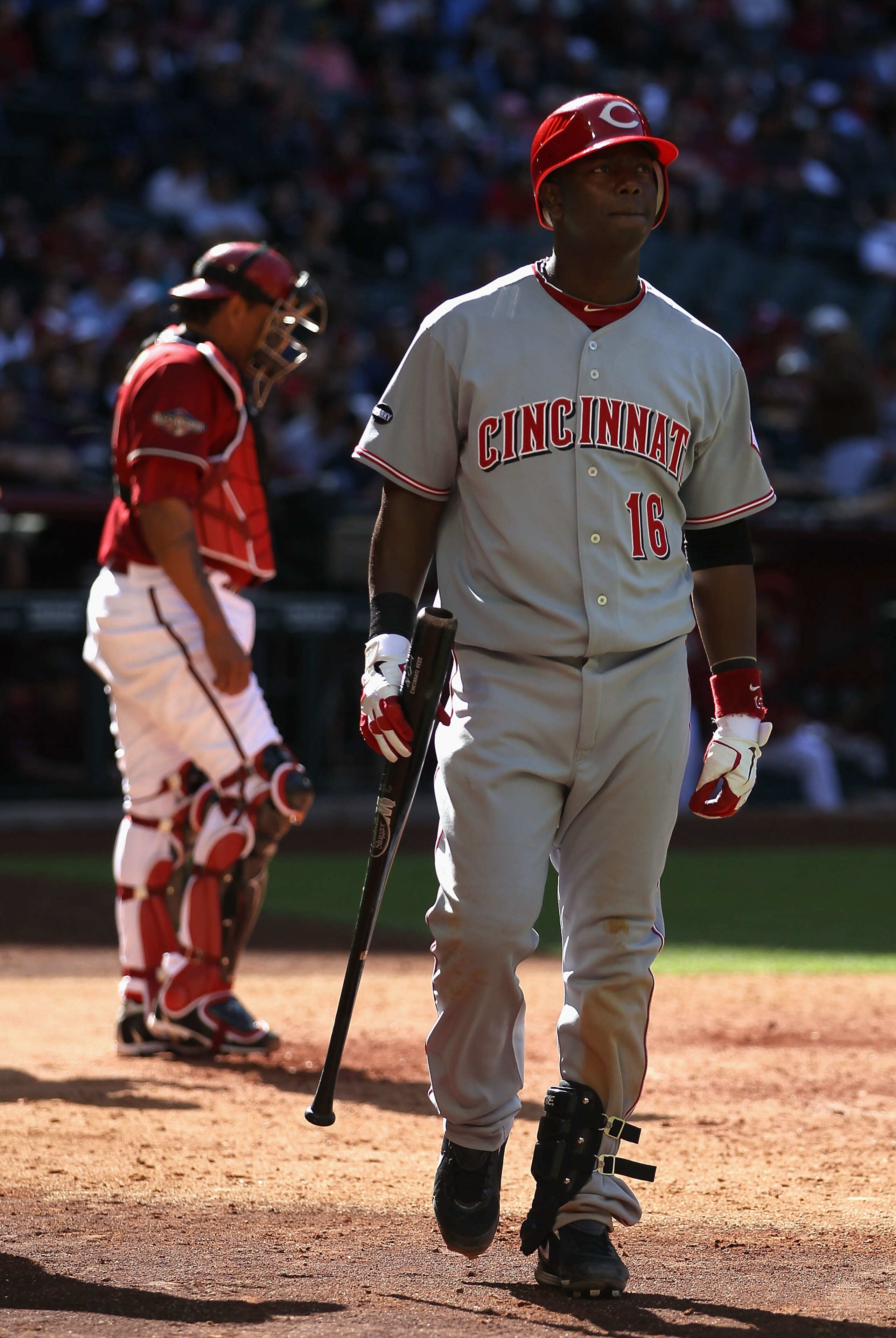 PHOENIX, AZ - APRIL 10:  Edgar Renteria #16 of the Cincinnati Reds walks back to the dugout after striking out against the Arizona Diamondbacks during the Major League Baseball game at Chase Field on April 10, 2011 in Phoenix, Arizona.  The Diamondbacks d