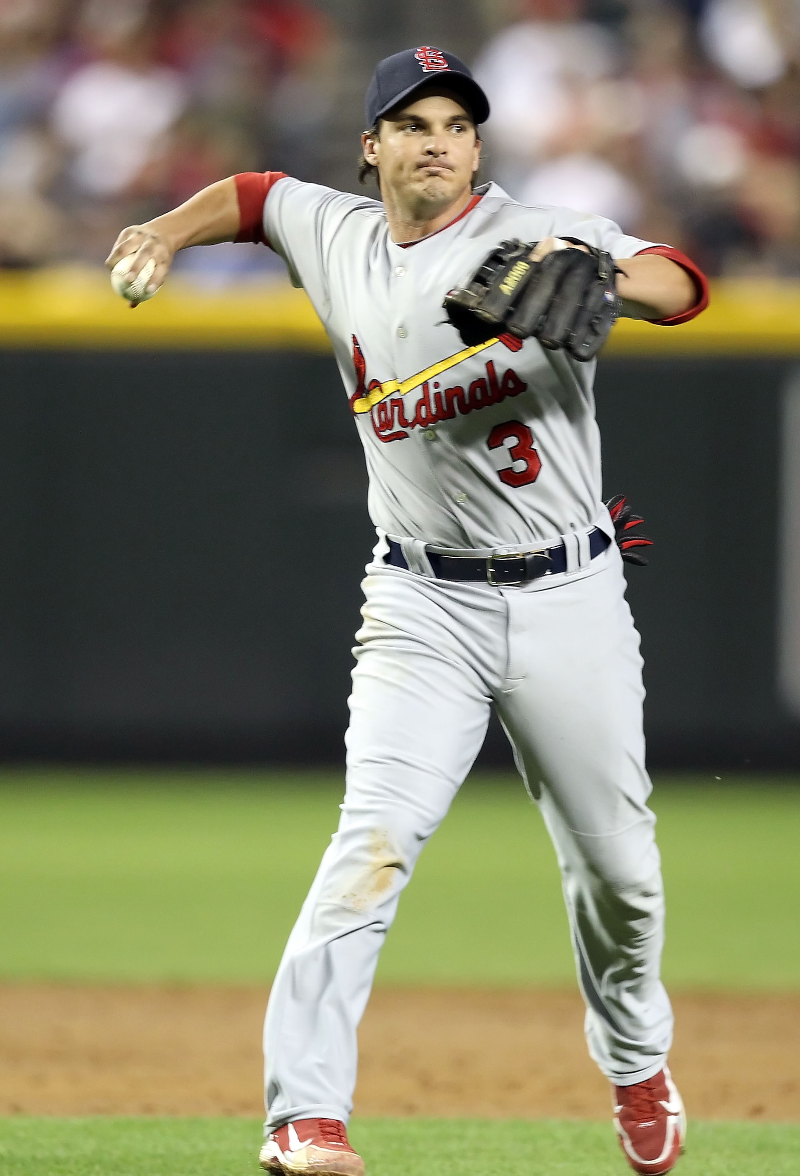 PHOENIX, AZ - APRIL 12:  Infielder Ryan Theriot #3 of the St. Louis Cardinals fields a ground ball out during the Major League Baseball game against the Arizona Diamondbacks at Chase Field on April 12, 2011 in Phoenix, Arizona. The Diamondbacks defeated t