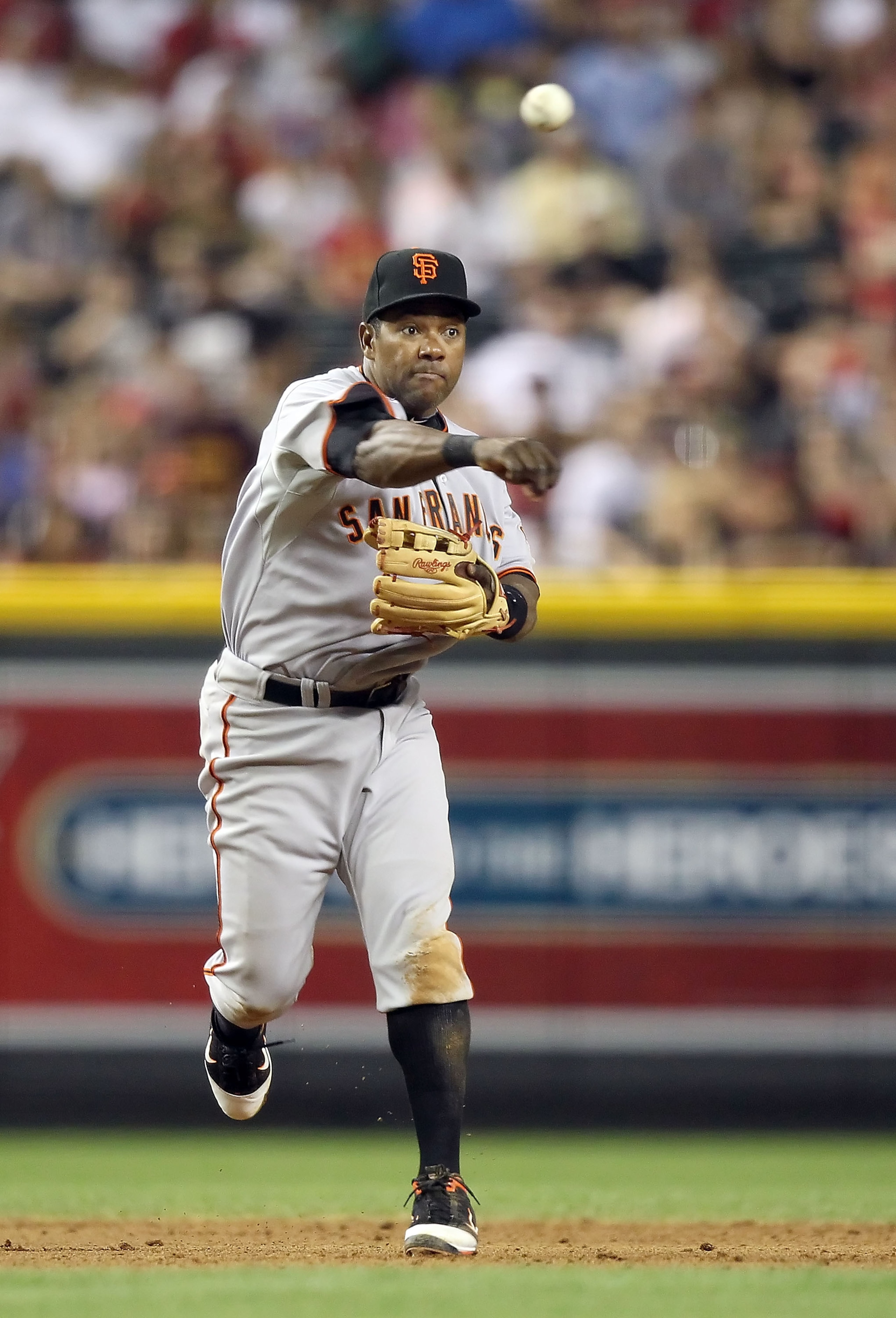 PHOENIX, AZ - APRIL 16:  Infielder Miguel Tejada #10 of the San Francisco Giants fields a ground ball out against the Arizona Diamondbacks during the Major League Baseball game at Chase Field on April 16, 2011 in Phoenix, Arizona. The Giants defeated the