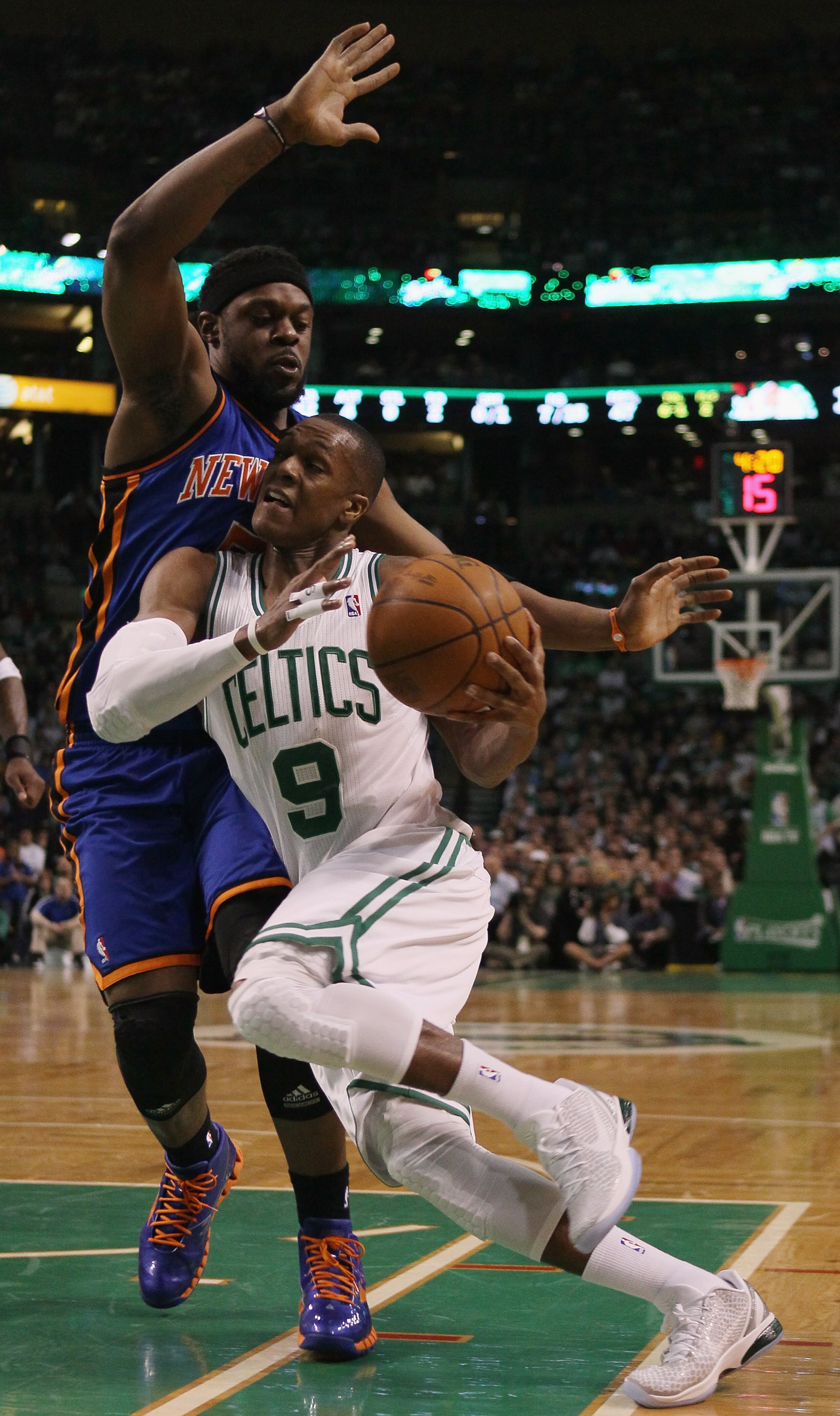 BOSTON, MA - APRIL 19:  Rajon Rondo #9 of the Boston Celtics heads for the basket as Bill Walker #5 of the New York Knicks defends in Game Two of the Eastern Conference Quarterfinals in the 2011 NBA Playoffs on April 19, 2011 at the TD Garden in Boston, M