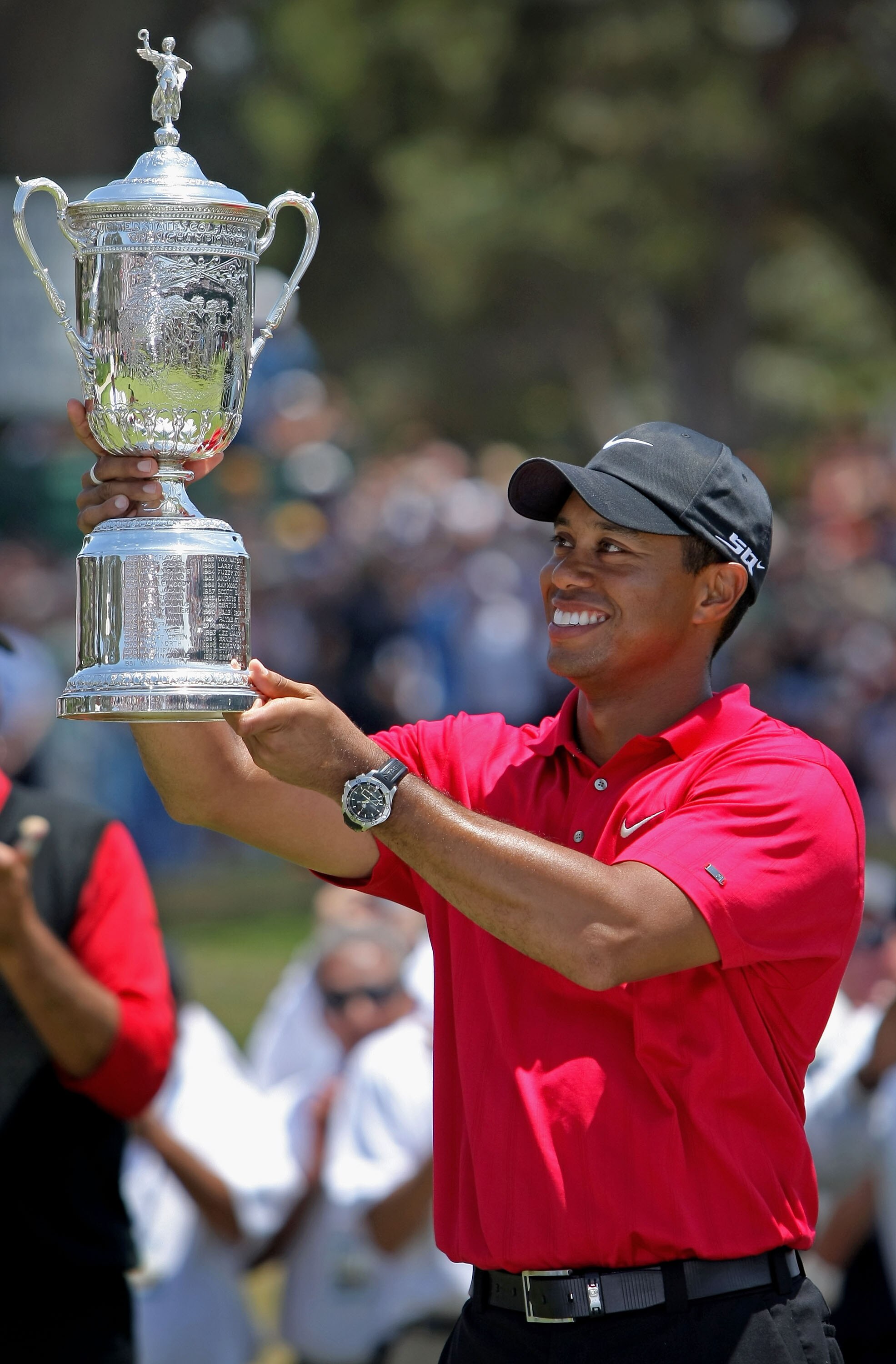SAN DIEGO - JUNE 16:  Tiger Woods celebrates with the trophy after winning on the first sudden death playoff hole during the playoff round of the 108th U.S. Open at the Torrey Pines Golf Course (South Course) on June 16, 2008 in San Diego, California.  (P